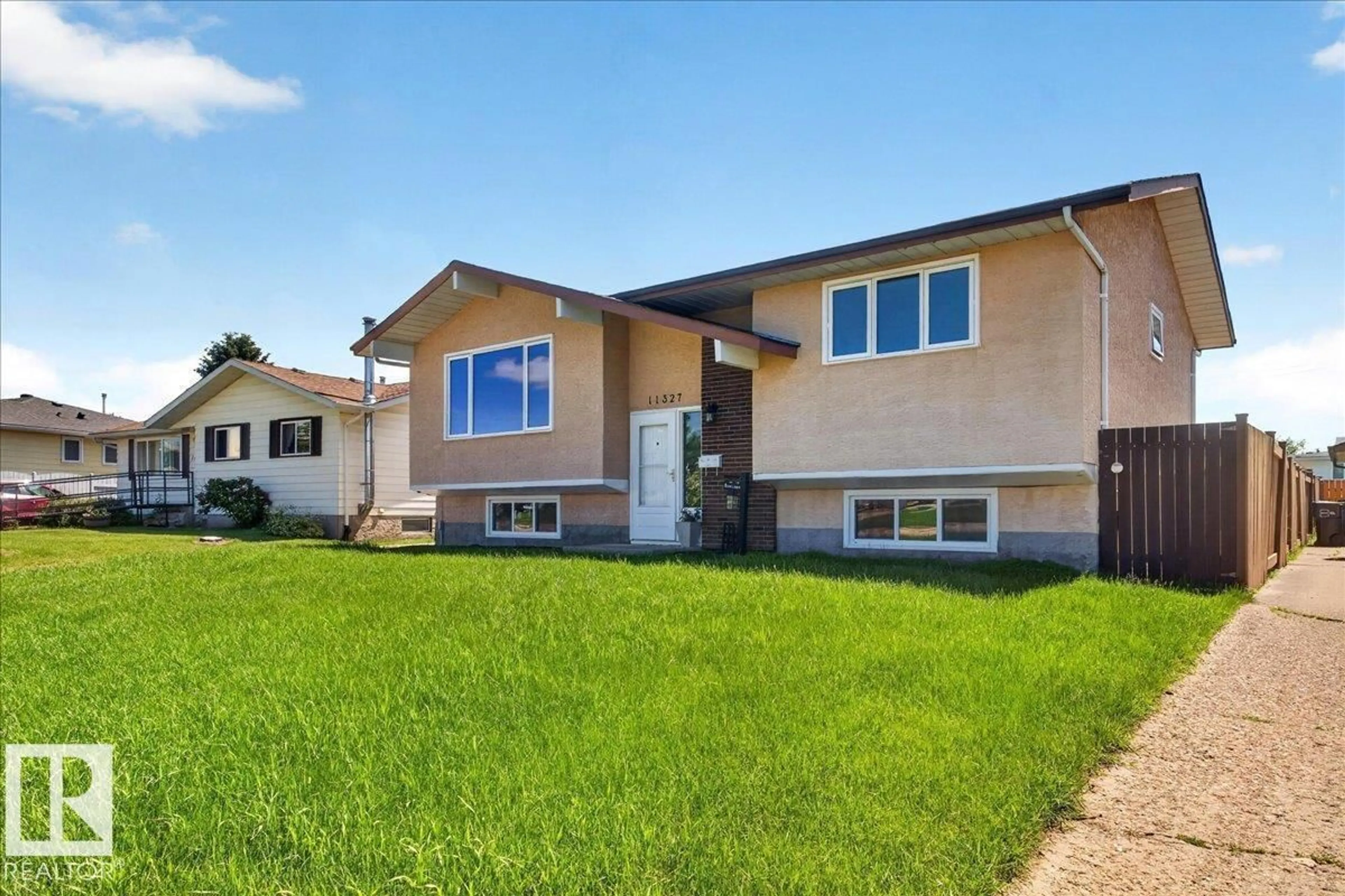 Home with vinyl exterior material, street for 11327 165 AV, Edmonton Alberta T5X3V8
