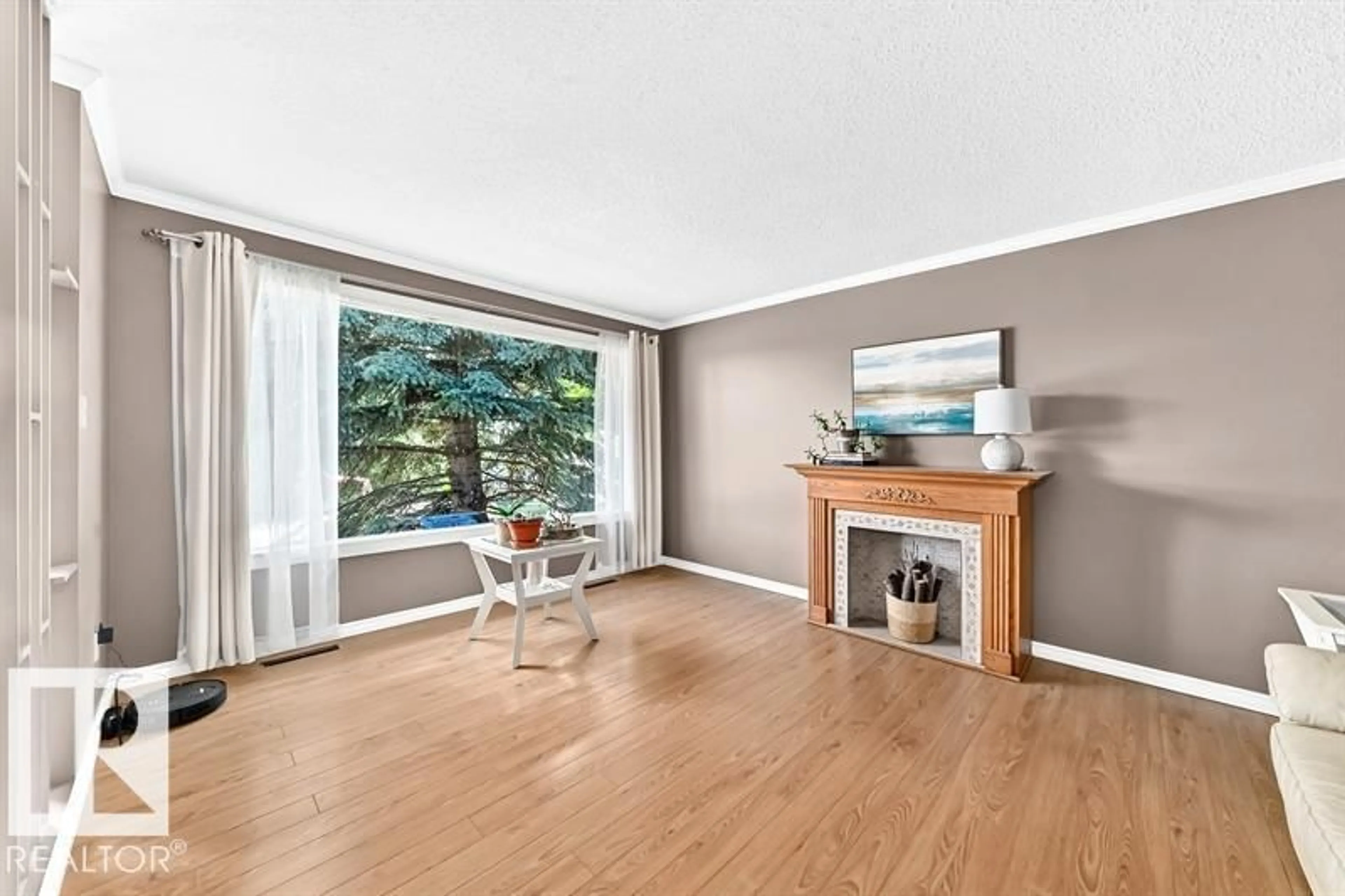 Living room with furniture, wood/laminate floor for 5408 47A ST, Wetaskiwin Alberta T9A1E8