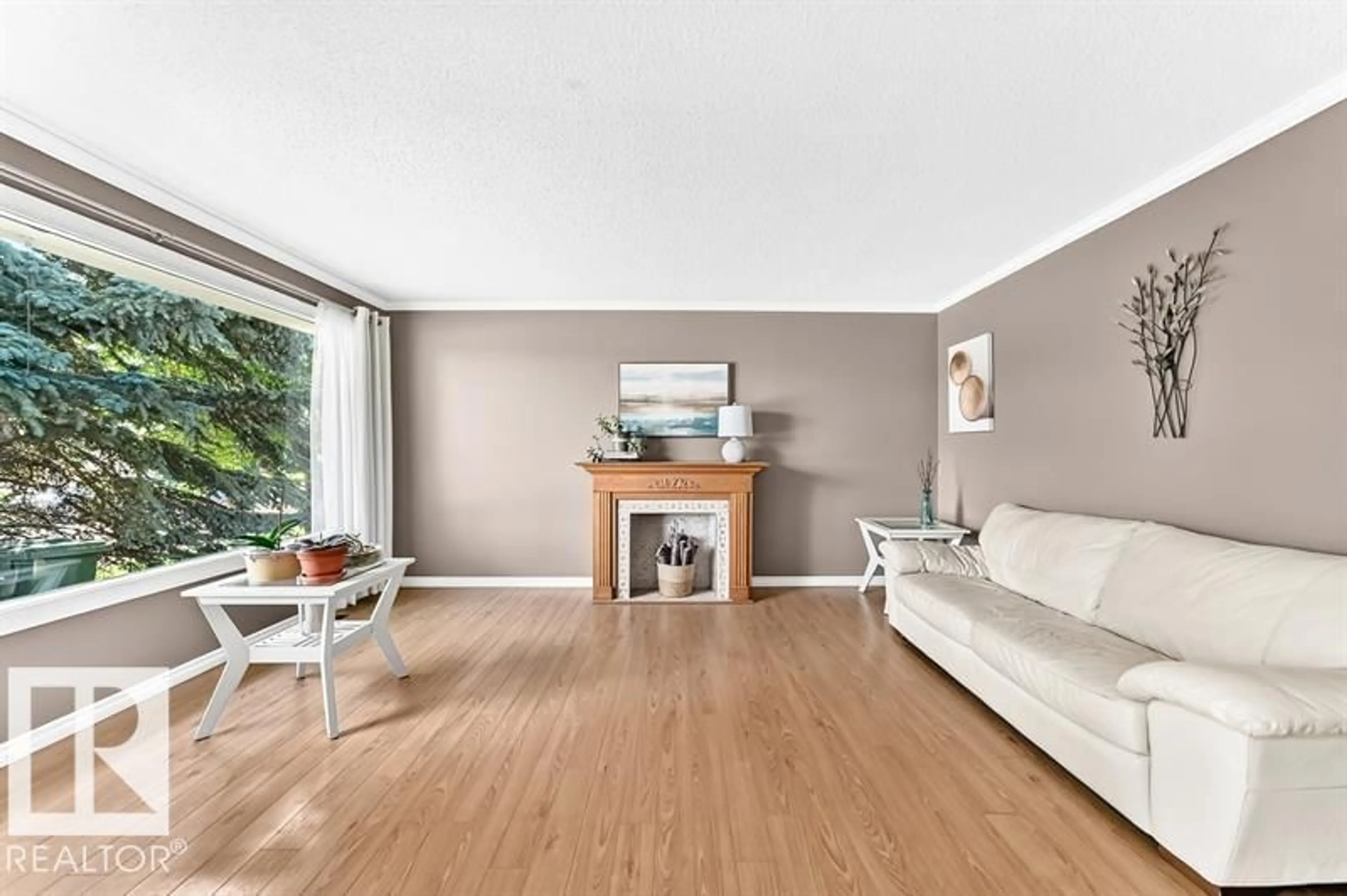 Living room with furniture, wood/laminate floor for 5408 47A ST, Wetaskiwin Alberta T9A1E8