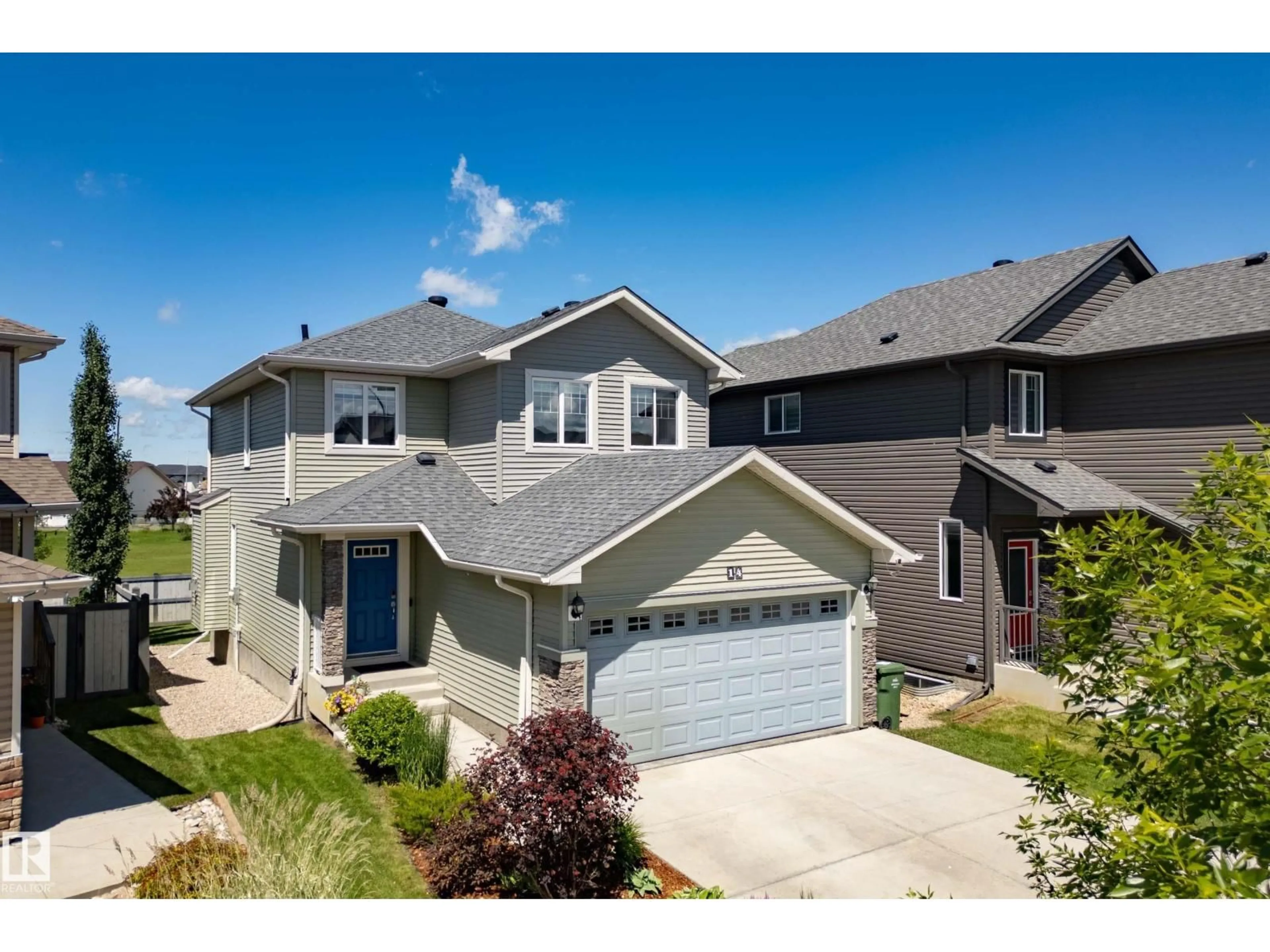 Home with vinyl exterior material, street for 14 MOBERG CL, Leduc Alberta T9E1E5