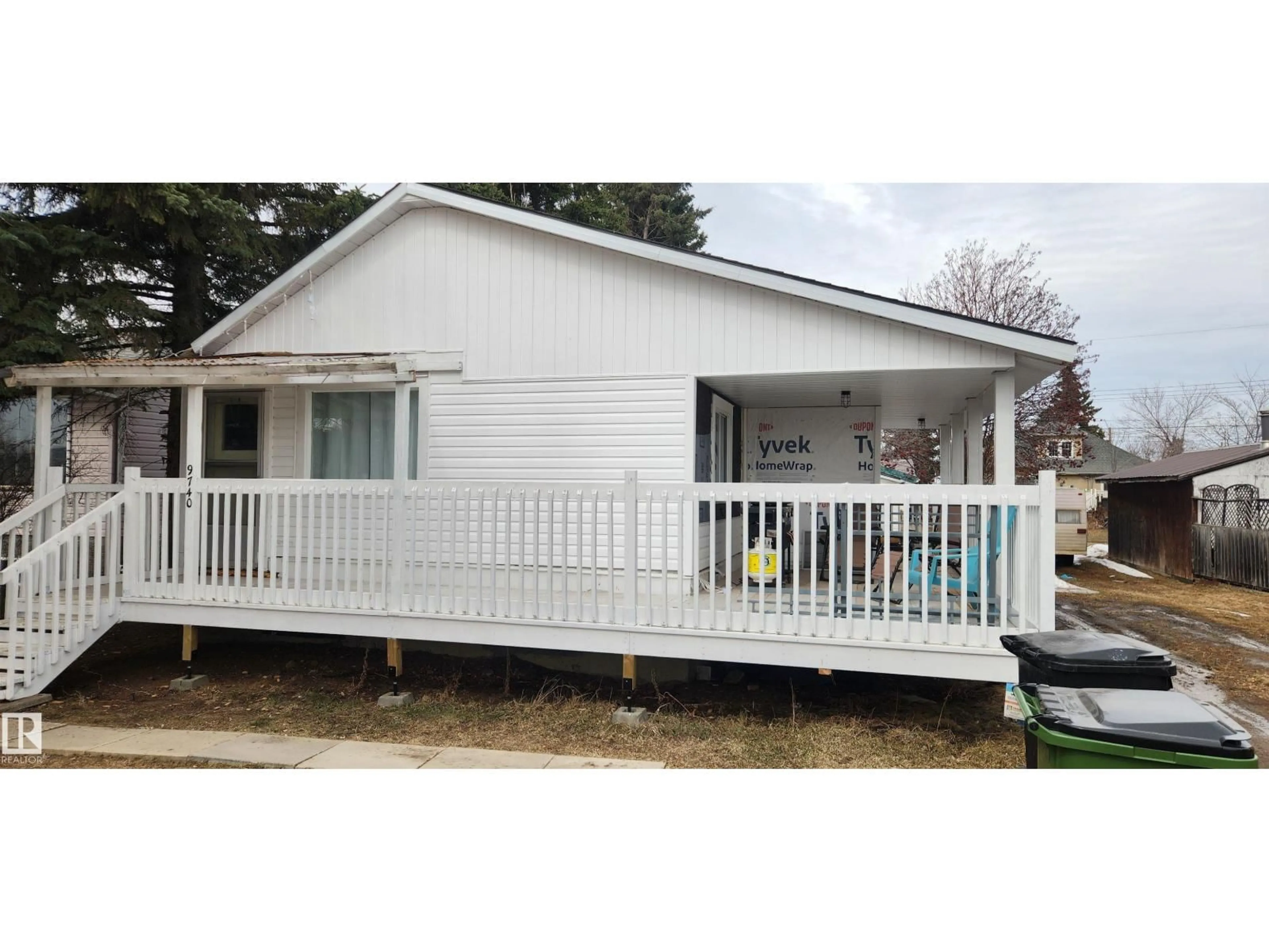 Home with vinyl exterior material, street for 9740 109 ST, Westlock Alberta T7P1P9