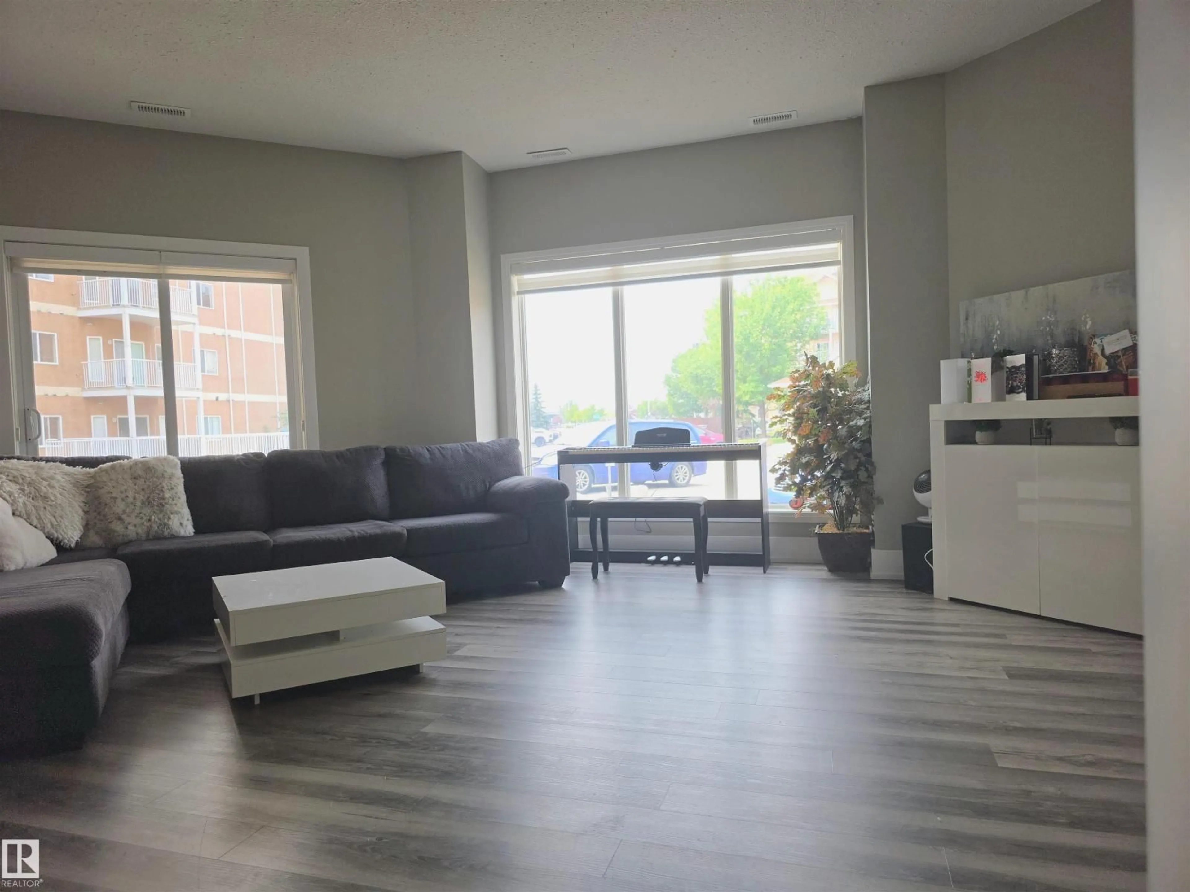 Living room with furniture, floor is not visible for #104 - 4312 139 AV, Edmonton Alberta T6T1E7