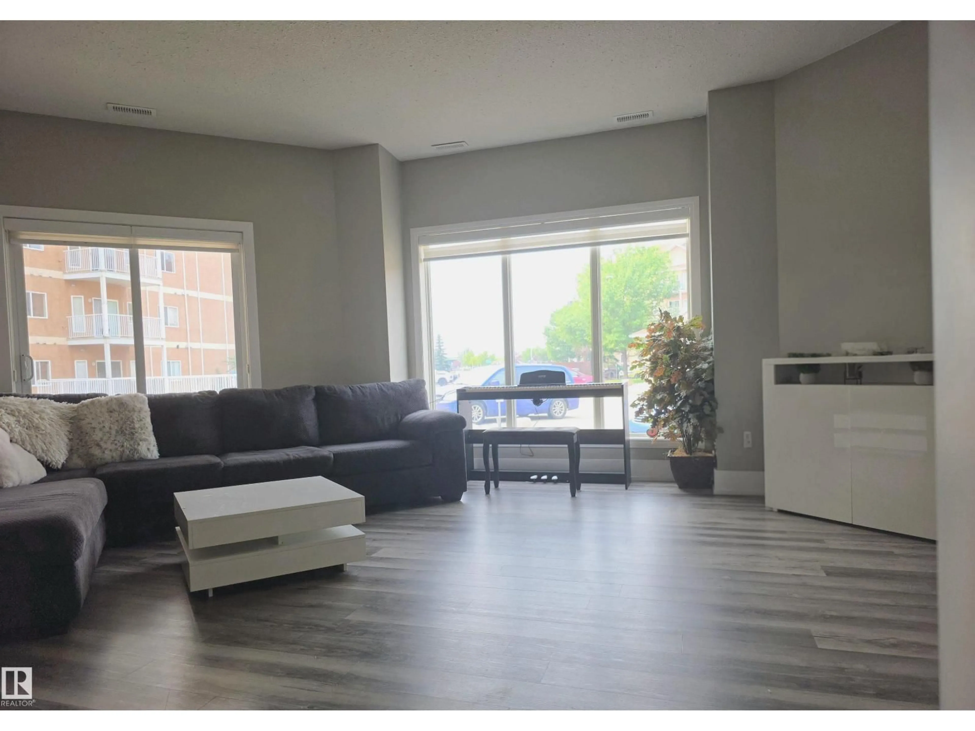 Living room with furniture, unknown for #104 - 4312 139 AV, Edmonton Alberta T6T1E7