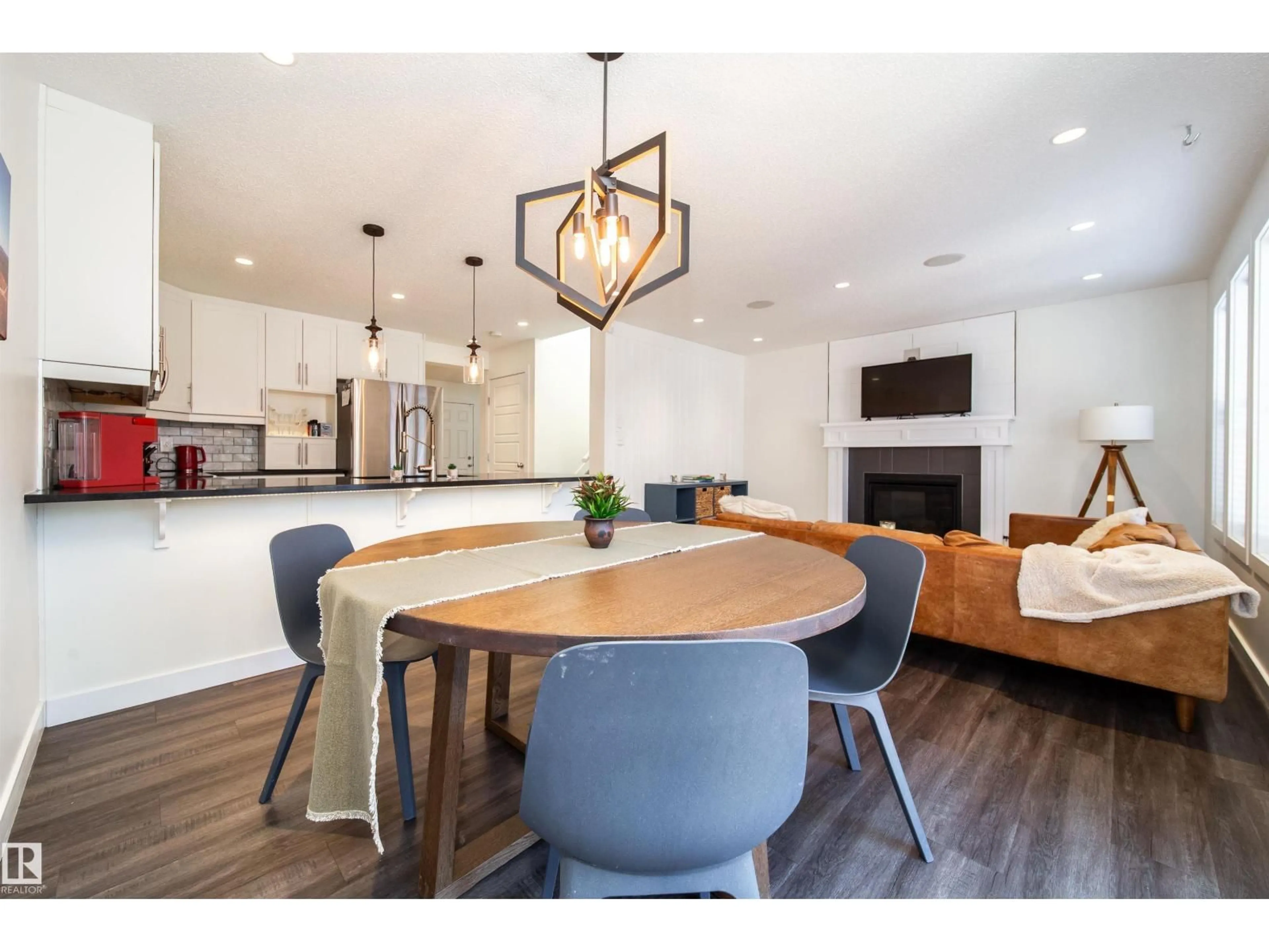 Open concept kitchen, wood/laminate floor for 8916 217 ST, Edmonton Alberta T5T7C4