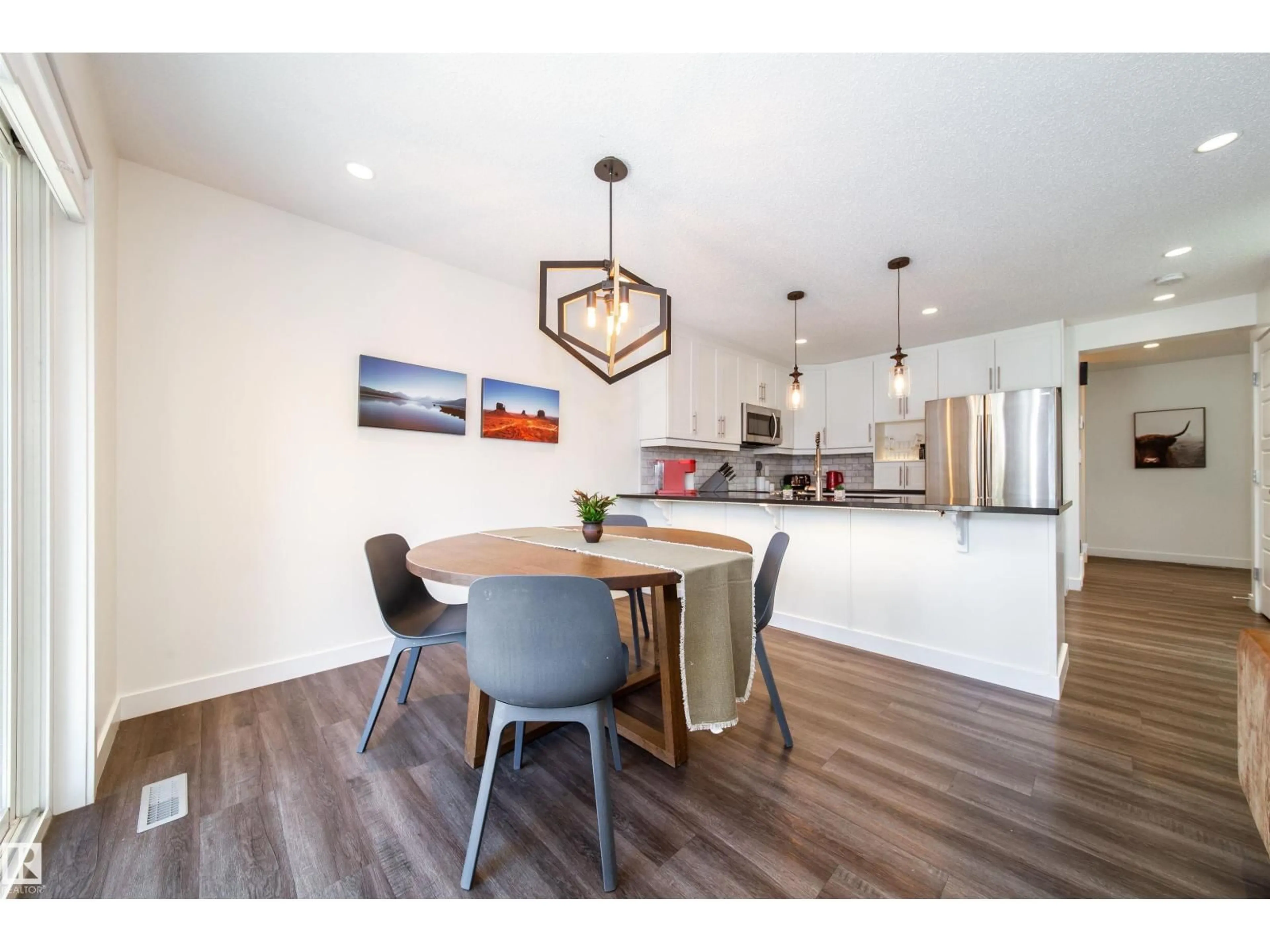 Open concept kitchen, wood/laminate floor for 8916 217 ST, Edmonton Alberta T5T7C4