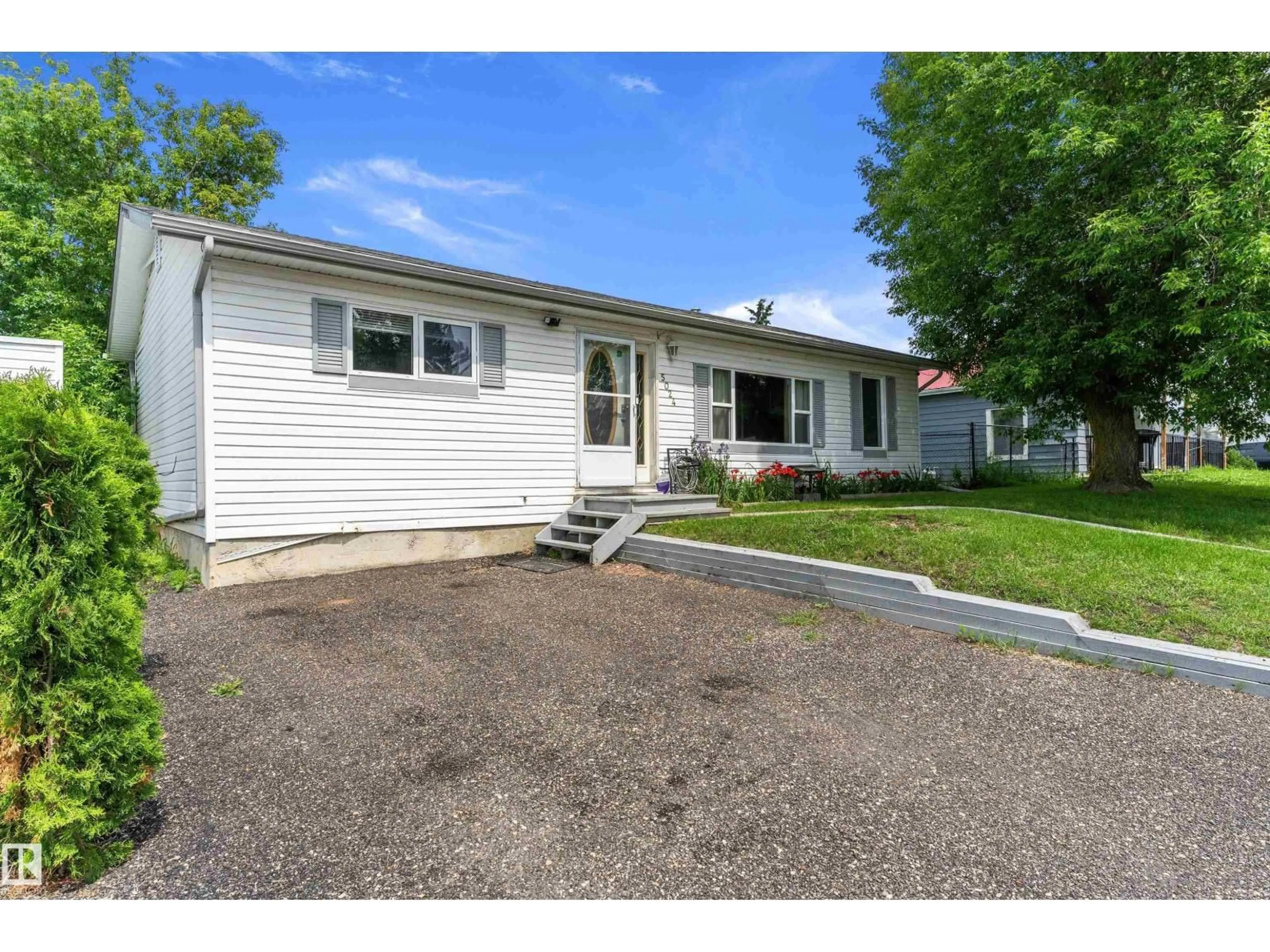 Home with vinyl exterior material, street for 5024 55 AV, Tofield Alberta T0B4J0