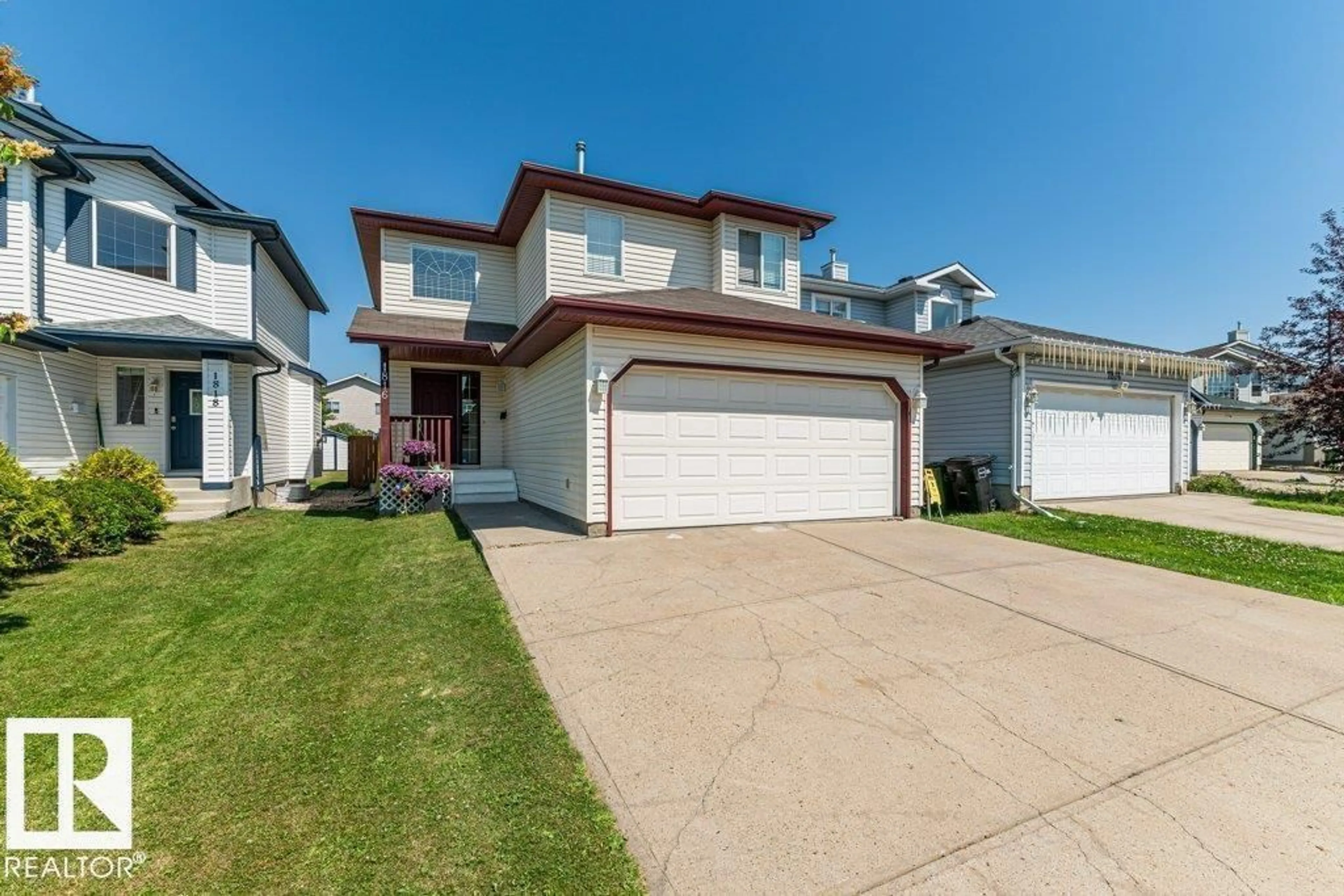 Home with vinyl exterior material, street for 1816 36 AV, Edmonton Alberta T6T1S8