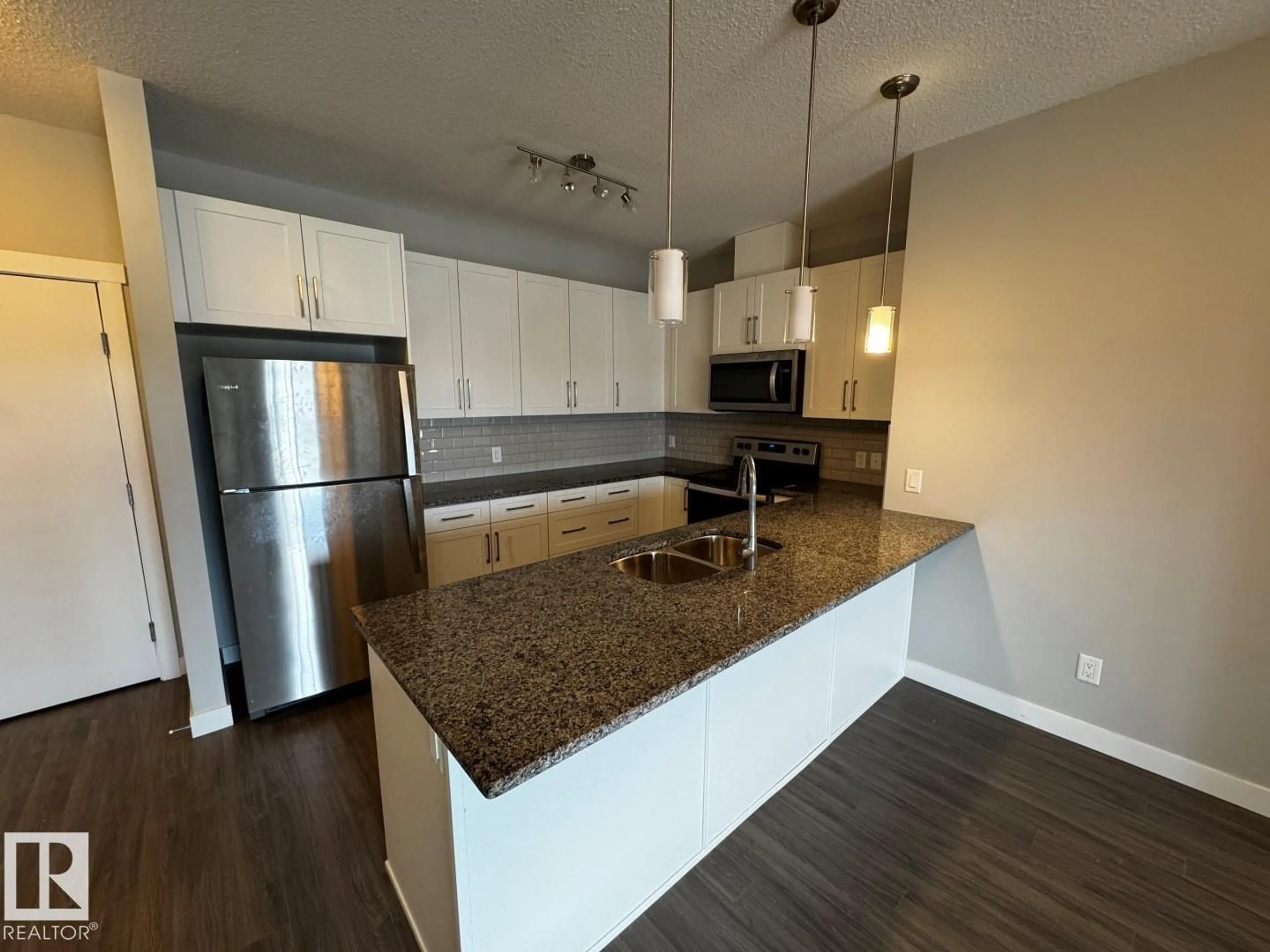 Open concept kitchen, unknown for #405 - 3670 139 AV, Edmonton Alberta T5Y3N5