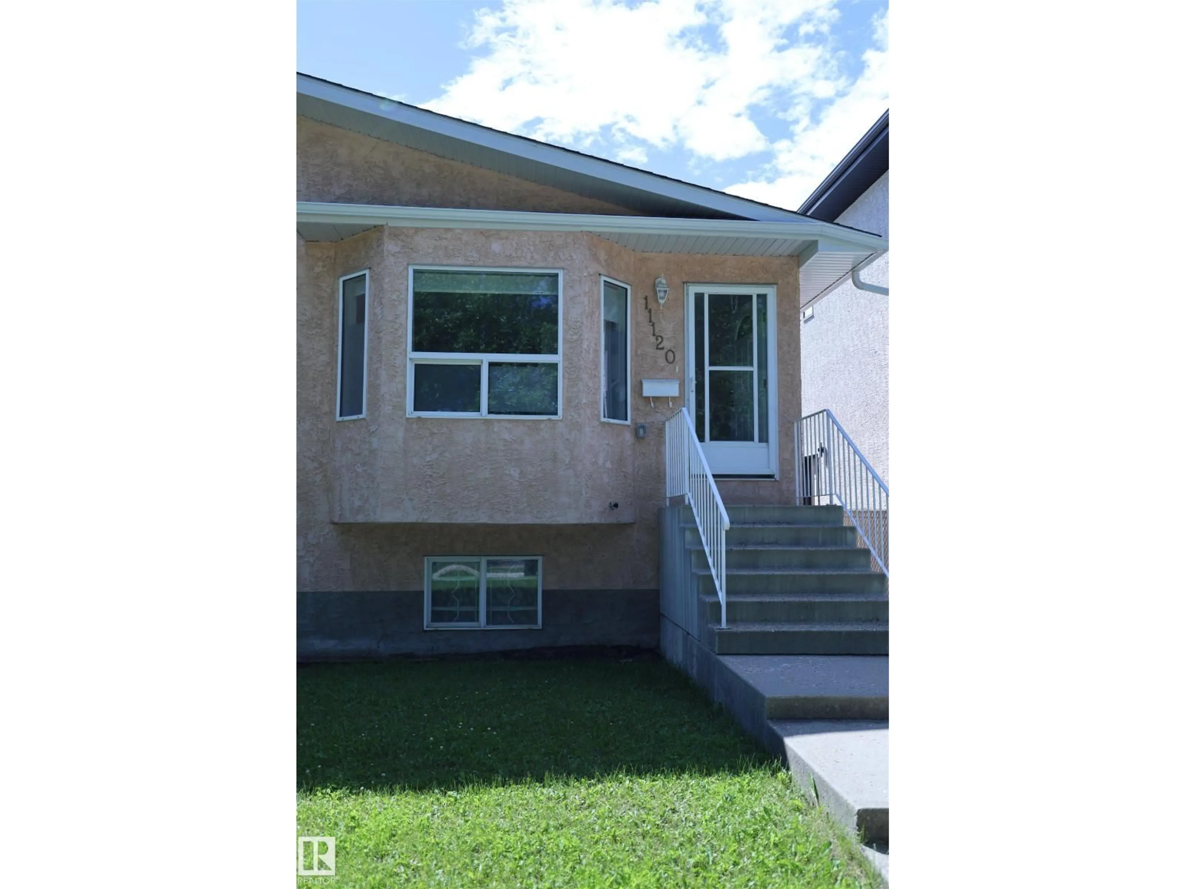 Home with vinyl exterior material, street for 11120 132 ST, Edmonton Alberta T5M1E6