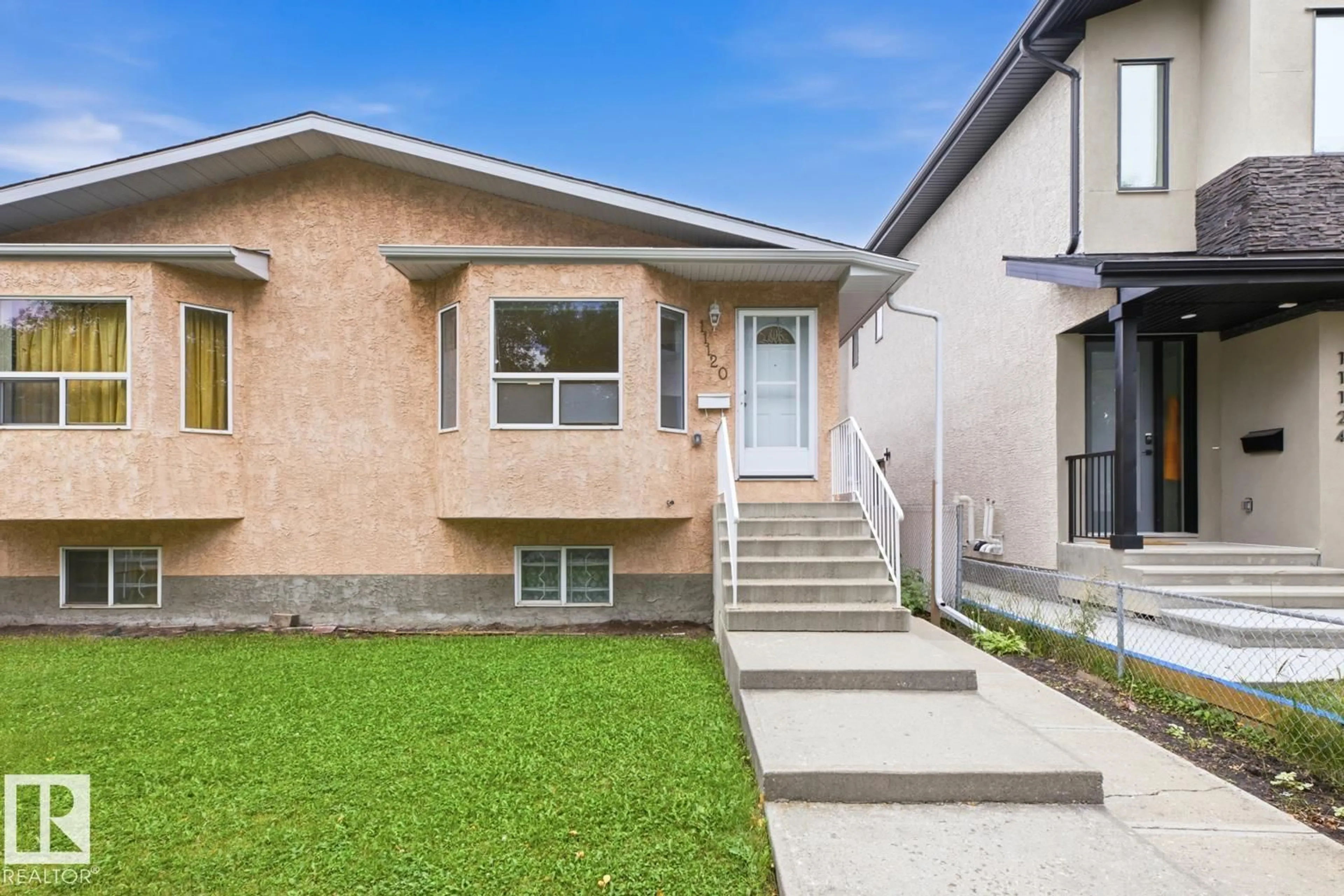 Home with vinyl exterior material, street for 11120 132 ST, Edmonton Alberta T5M1E6