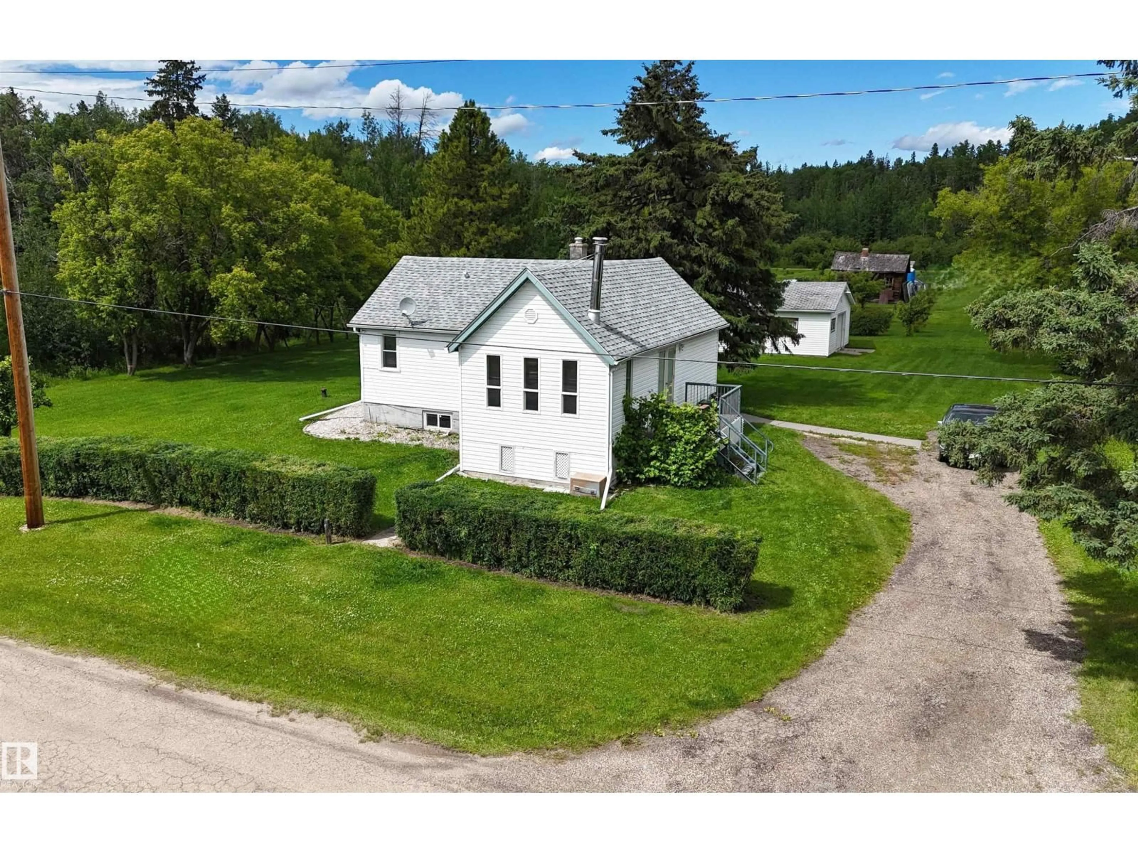 A pic from outside/outdoor area/front of a property/back of a property/a pic from drone, building for 4712 54 AV, Wabamun Alberta T0E0K0