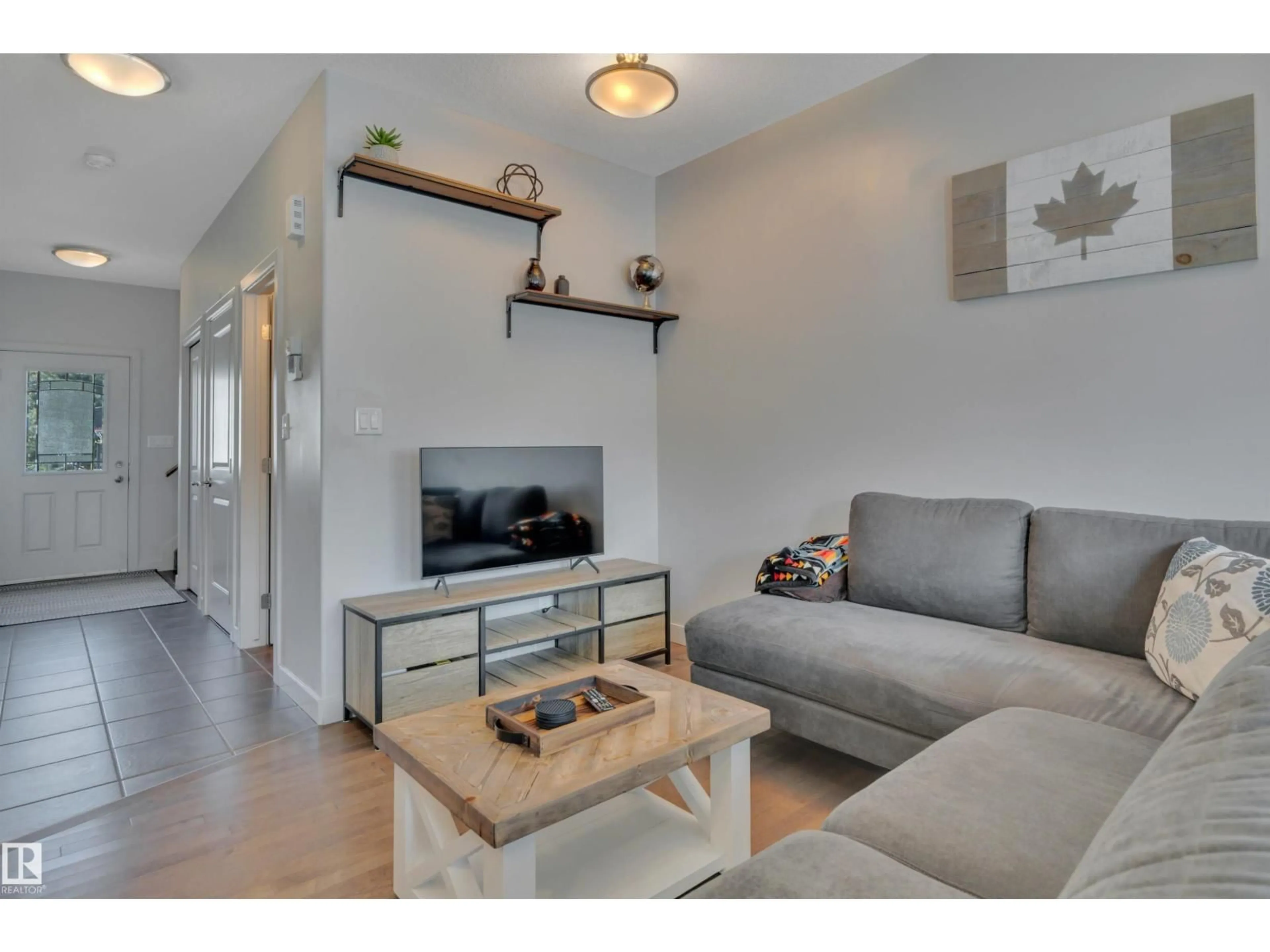 Living room with furniture, wood/laminate floor for 36 - 450 MCCONACHIE WY, Edmonton Alberta T5Y0S8