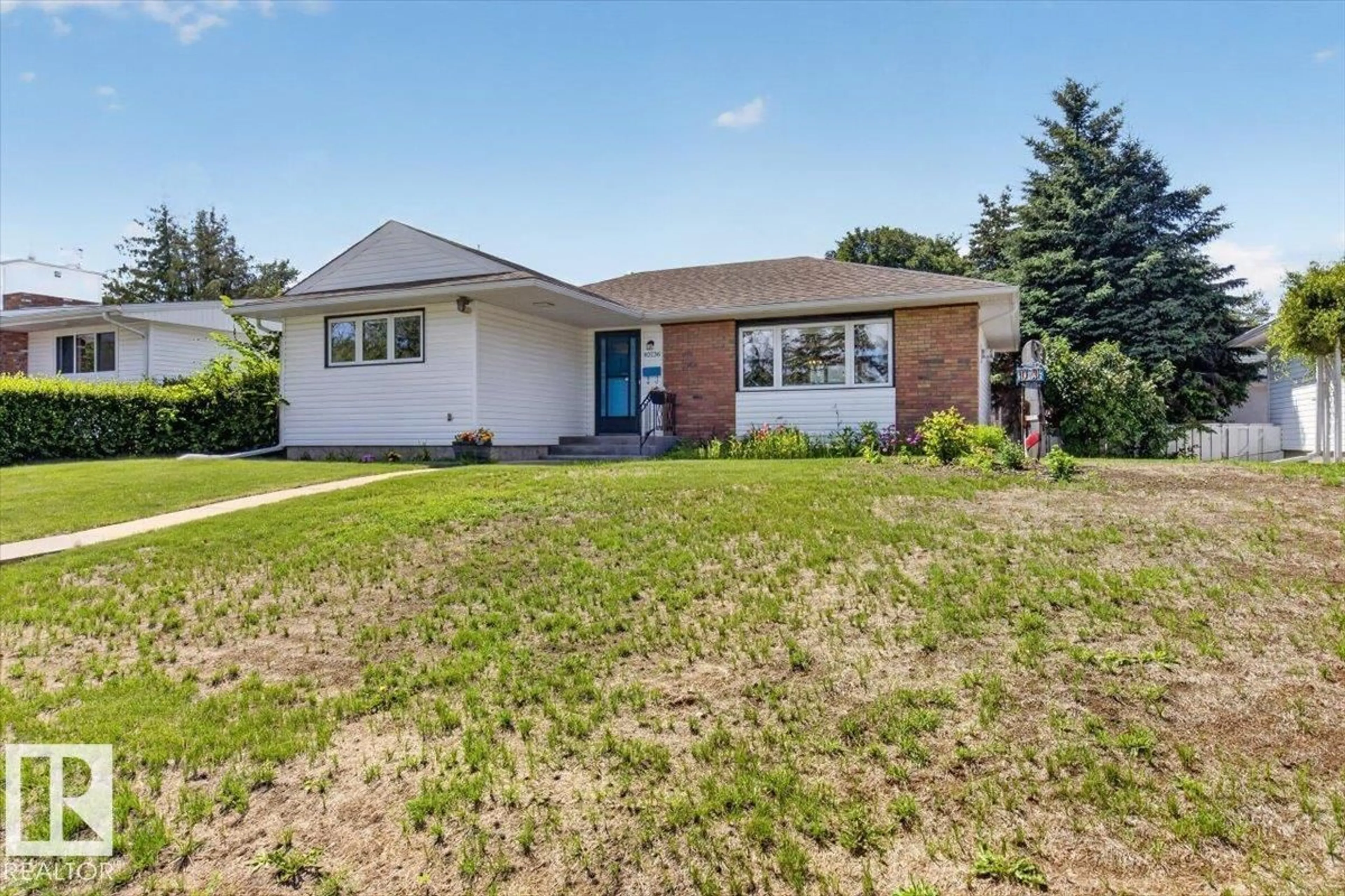 Home with brick exterior material, street for 10736 48 ST, Edmonton Alberta T6A2B5