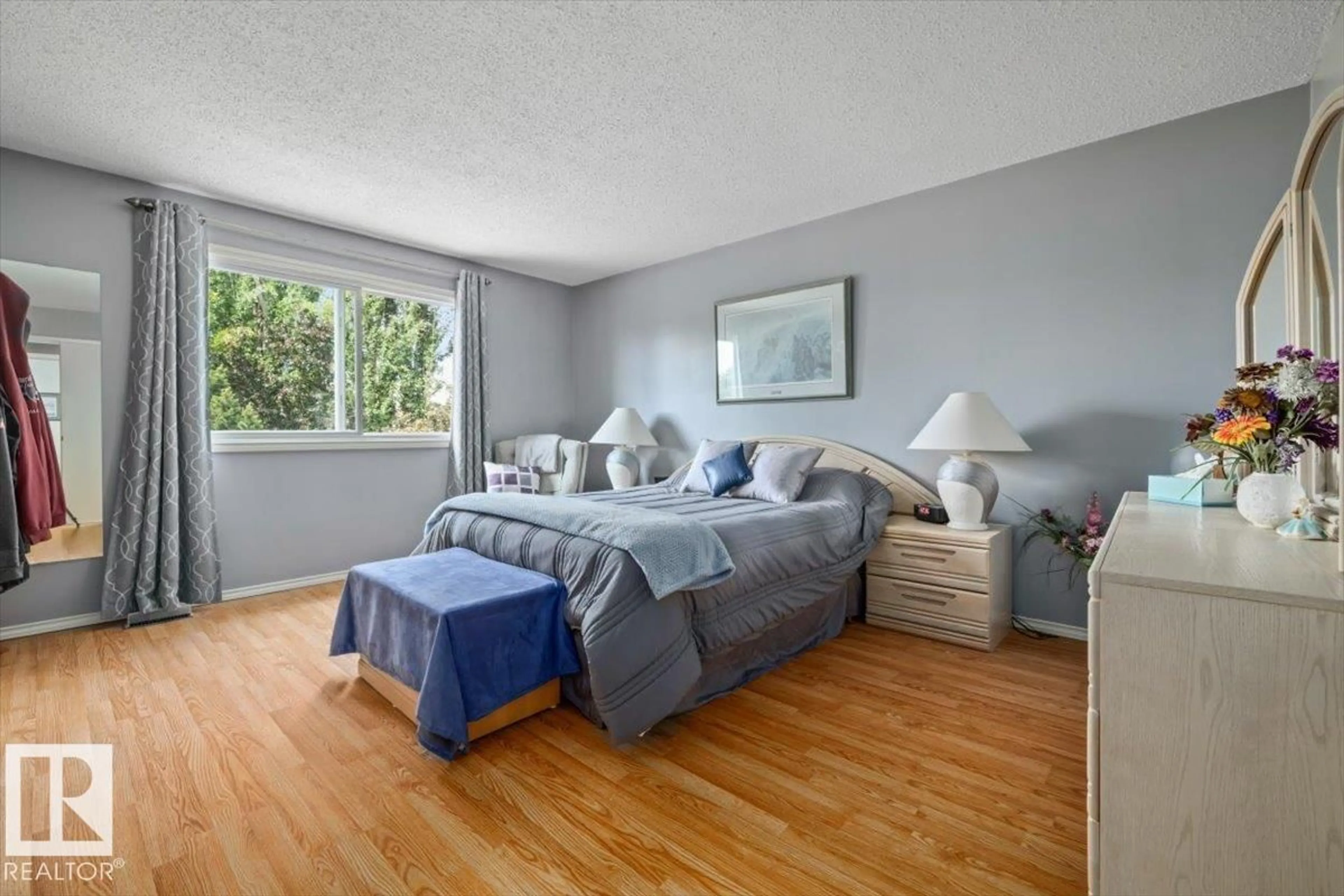 Bedroom with bed, wood/laminate floor for NW - 15908 112 ST, Edmonton Alberta T5X4S8