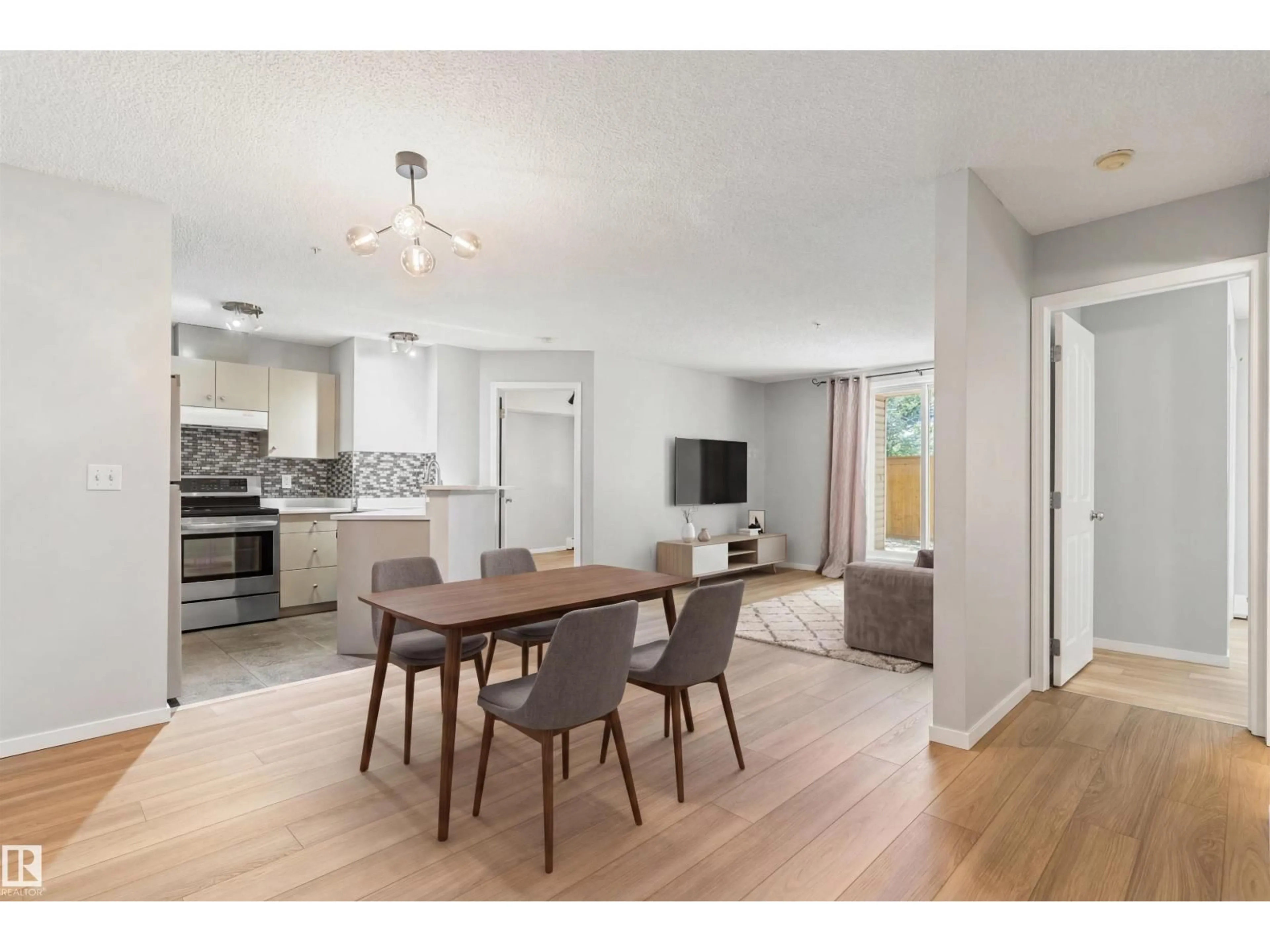 Open concept kitchen, wood/laminate floor for #112 - 112 11214 80 ST NW, Edmonton Alberta T5B4X9