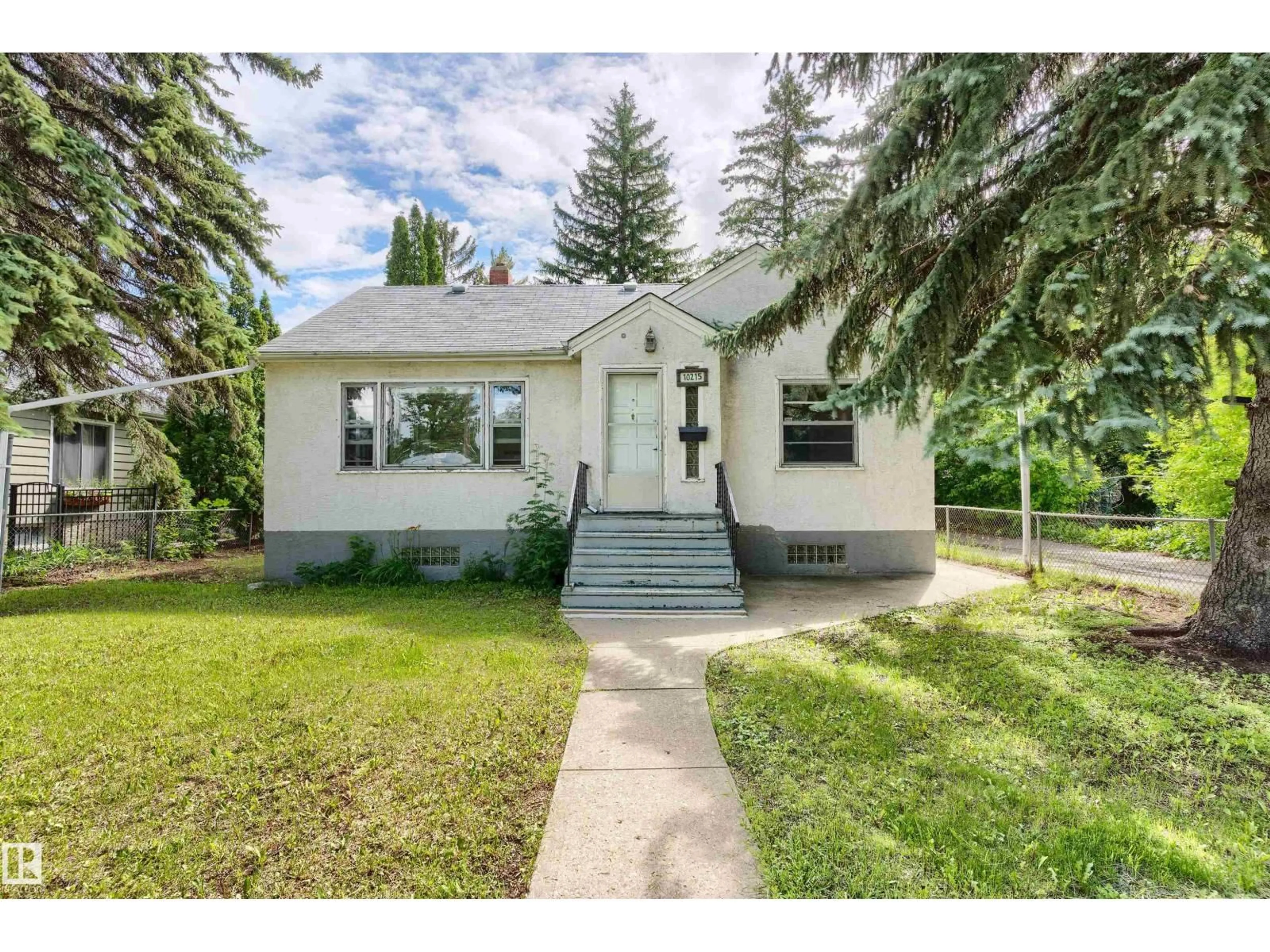 Home with vinyl exterior material, street for 10215 138 ST, Edmonton Alberta T5N2H9