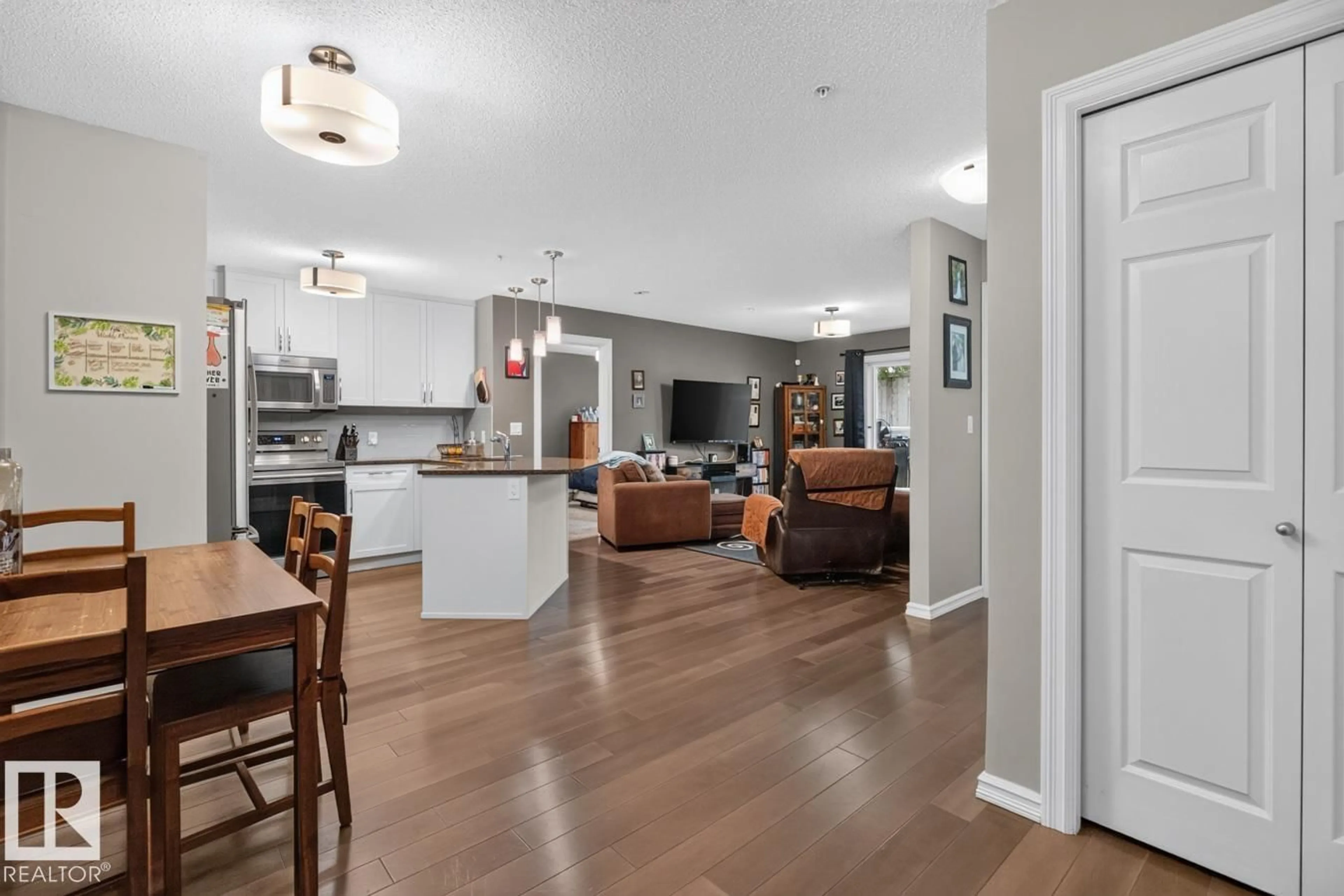 Open concept kitchen, wood/laminate floor for #103 - 2203 44 AV, Edmonton Alberta T6T0G5