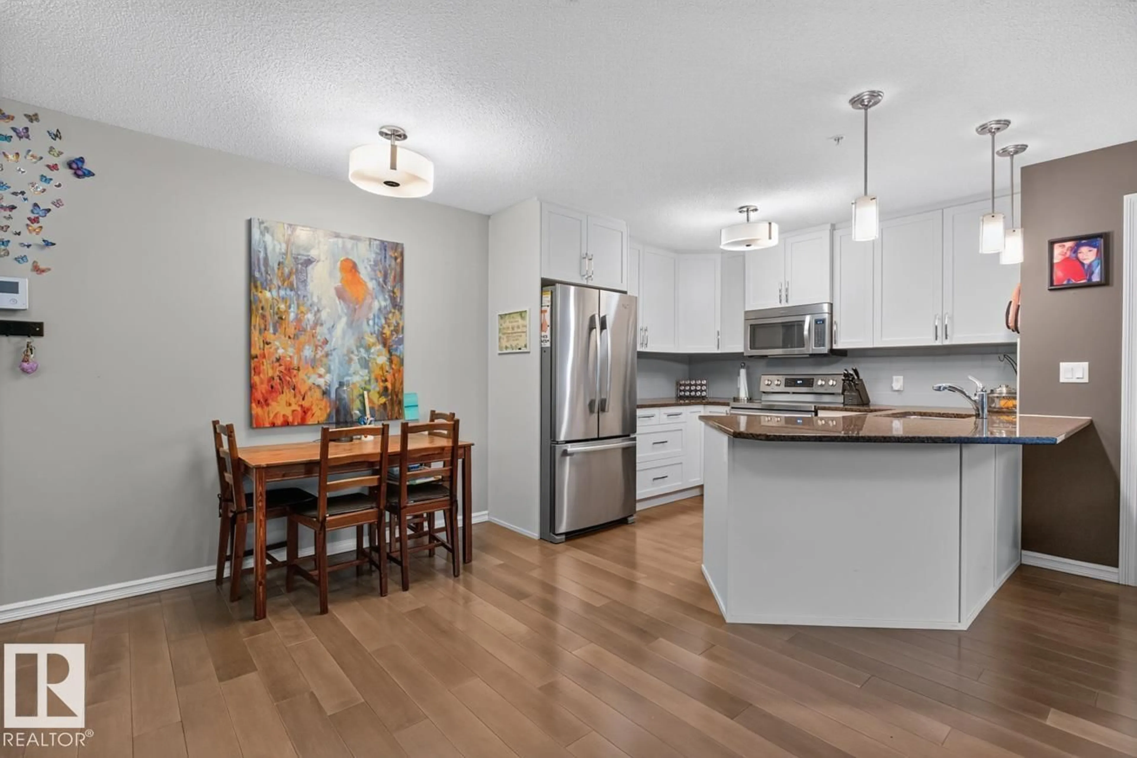 Open concept kitchen, wood/laminate floor for #103 - 2203 44 AV, Edmonton Alberta T6T0G5