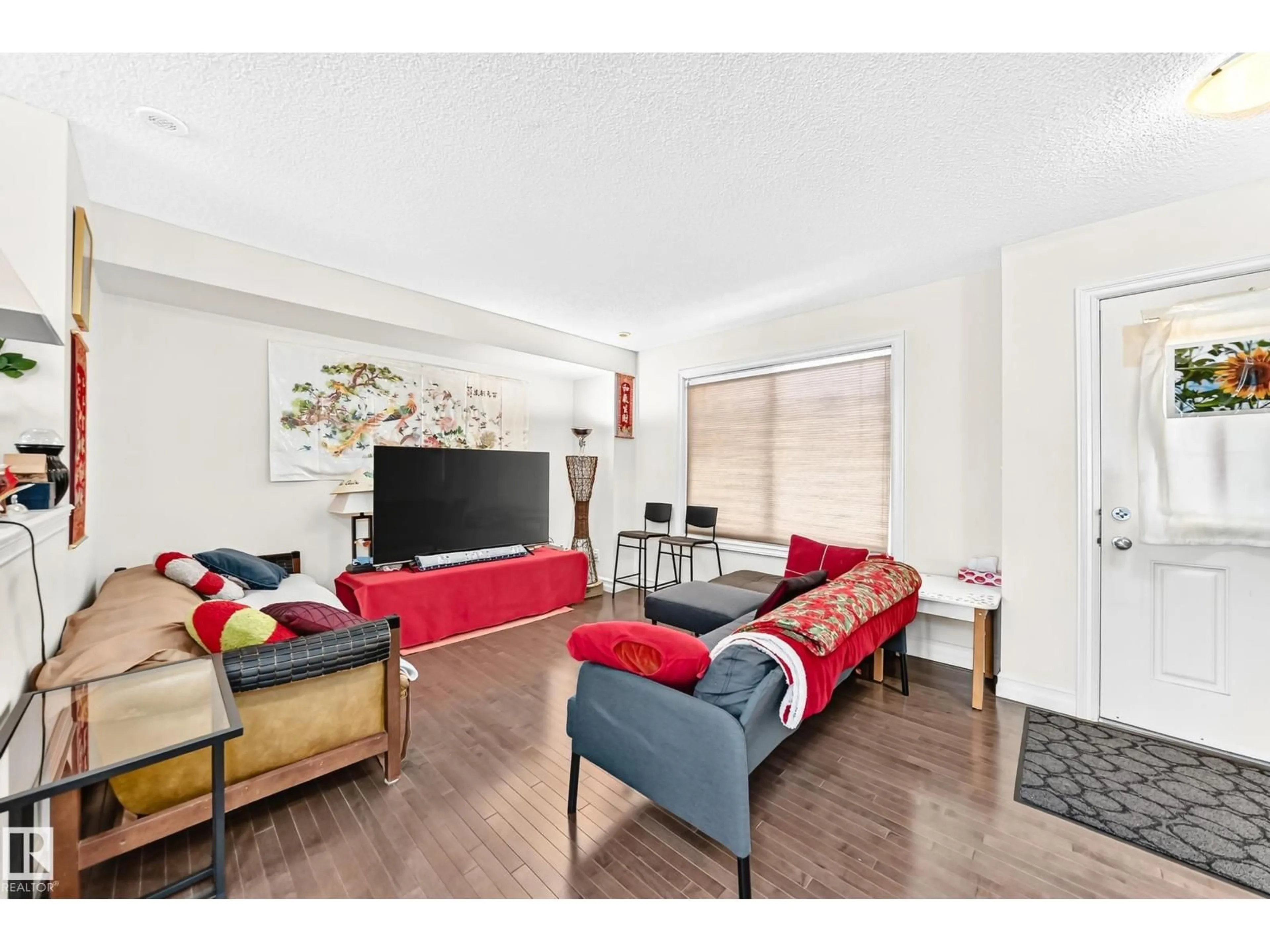 Living room with furniture, wood/laminate floor for #78 - 655 TAMARACK RD, Edmonton Alberta T6T0N4
