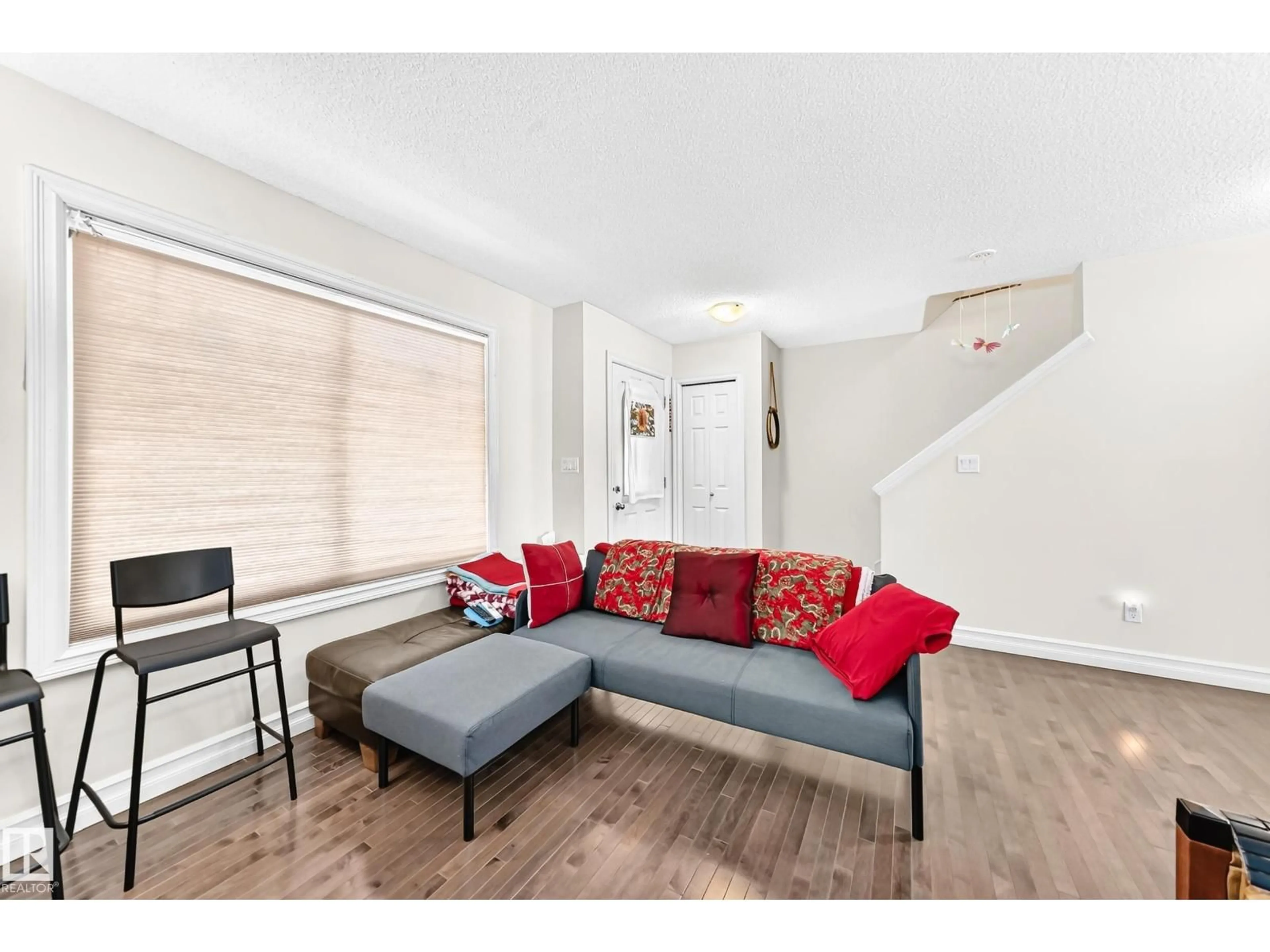 Living room with furniture, wood/laminate floor for #78 - 655 TAMARACK RD, Edmonton Alberta T6T0N4