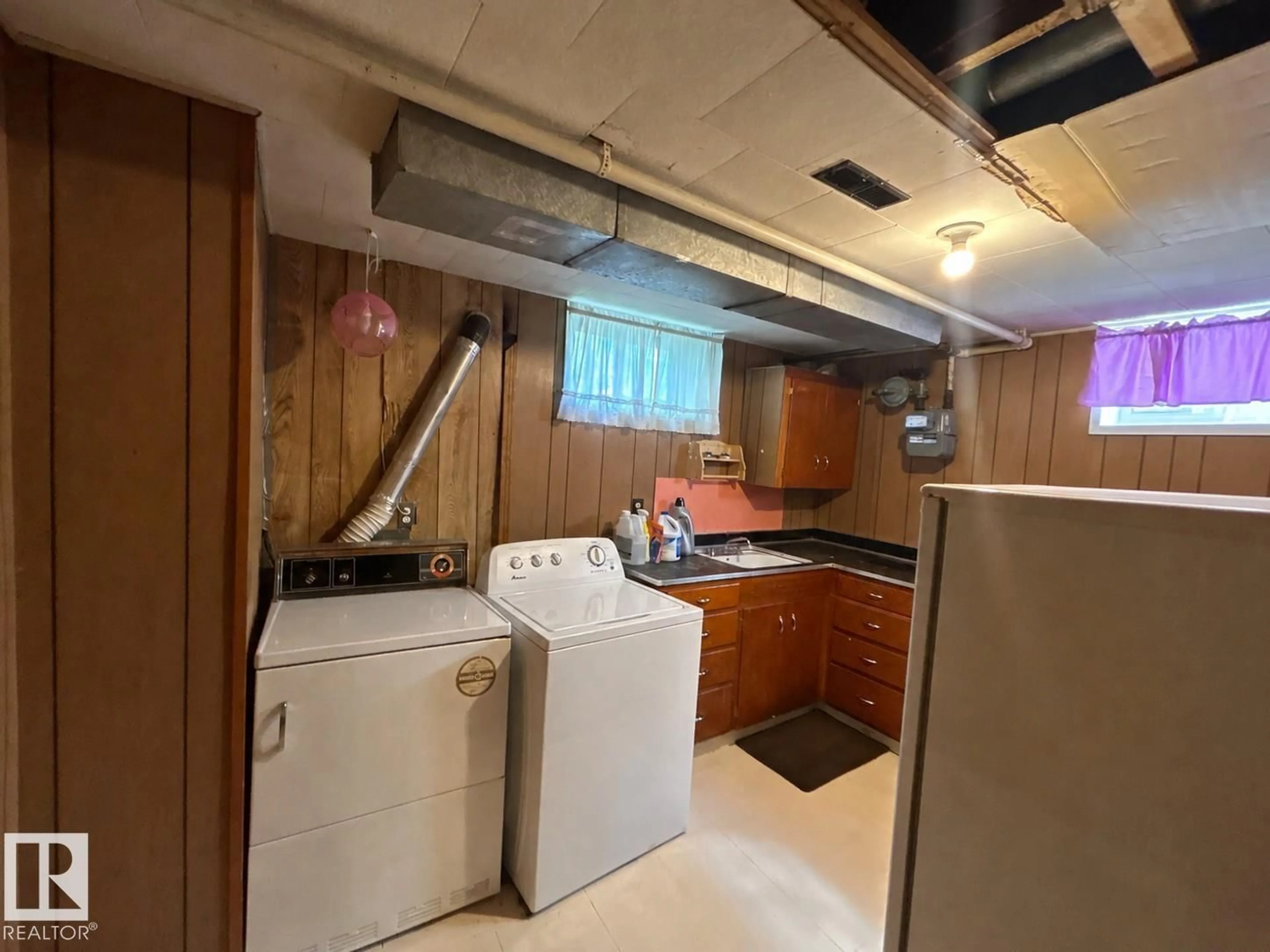 Kitchen with laundary machines, unknown for 5215 46 ST, Legal Alberta T0G1L0