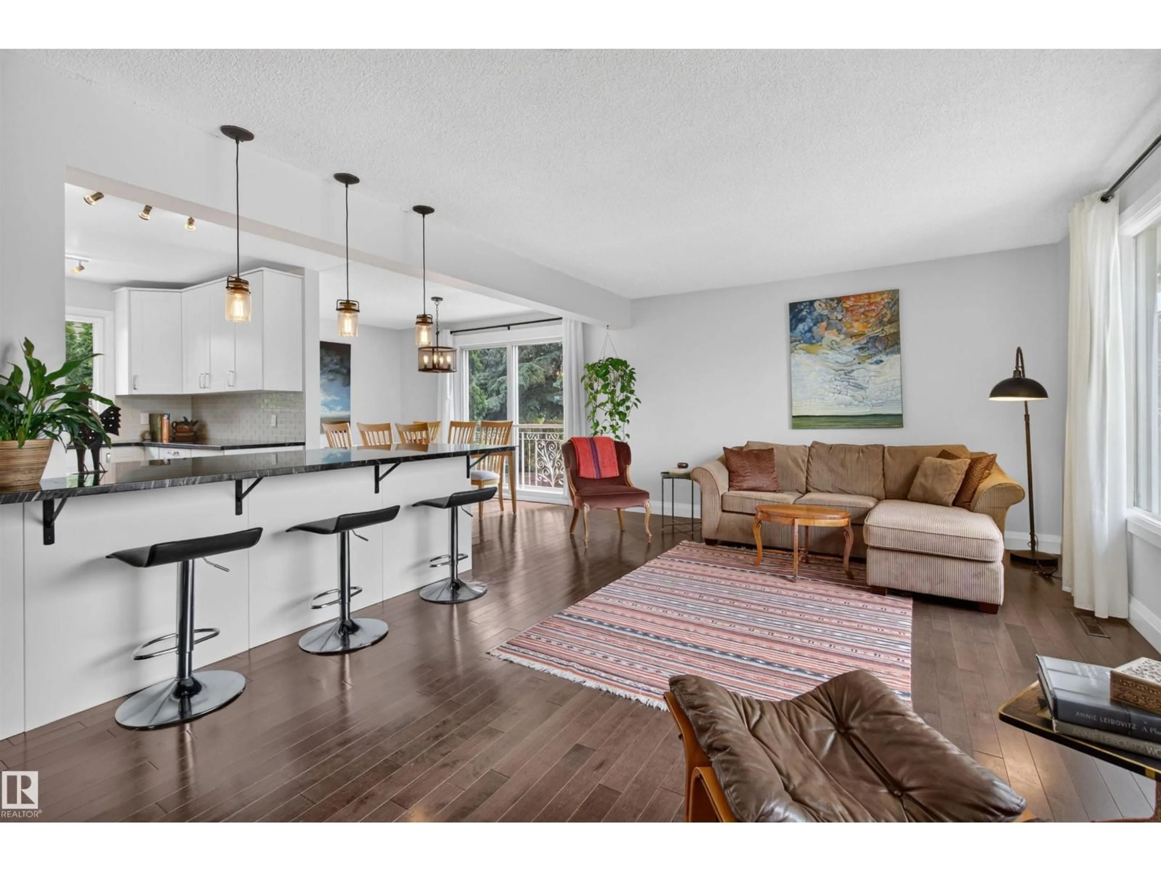Open concept kitchen, wood/laminate floor for 8603 73 ST, Edmonton Alberta T6B1Z9