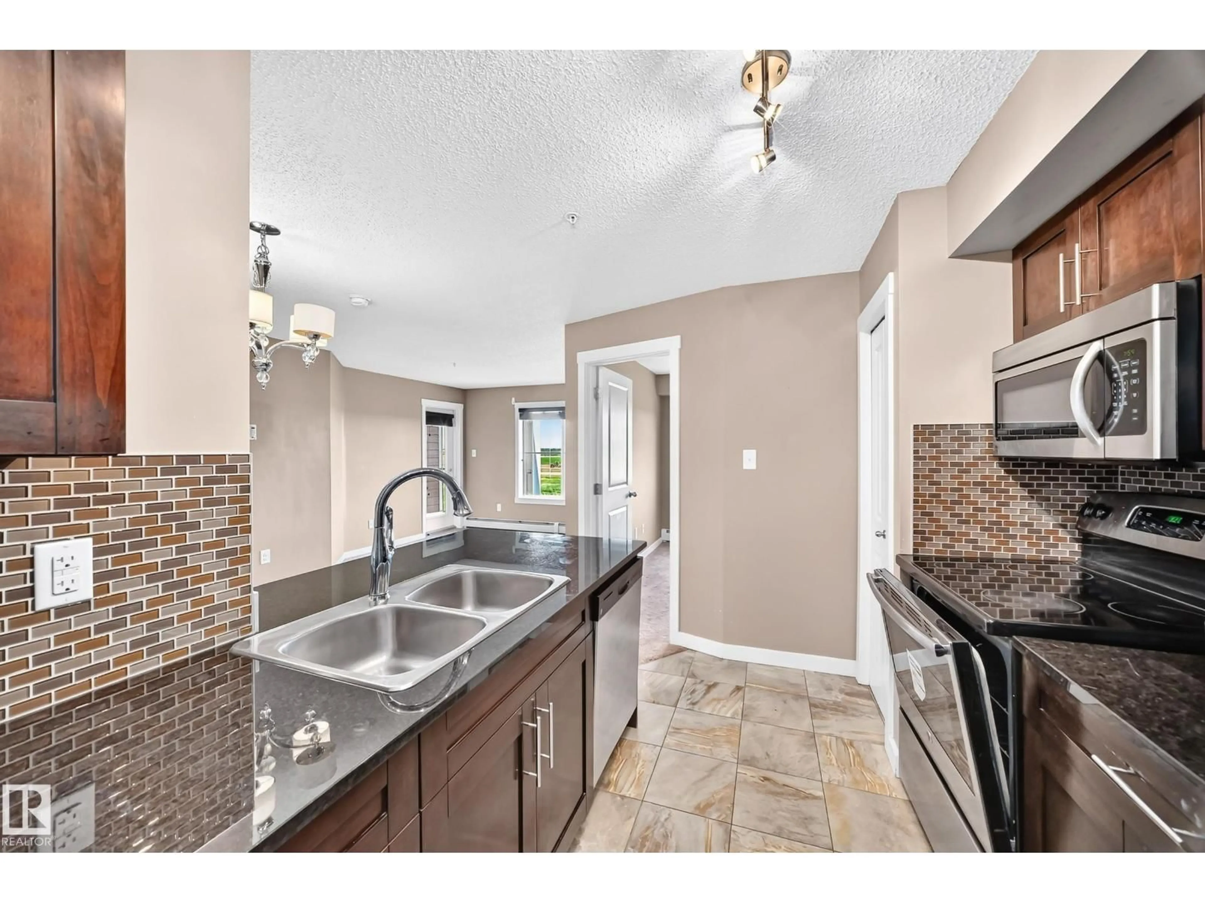 Open concept kitchen, ceramic/tile floor for #308 - 18126 77 ST NW, Edmonton Alberta T5Z0N7