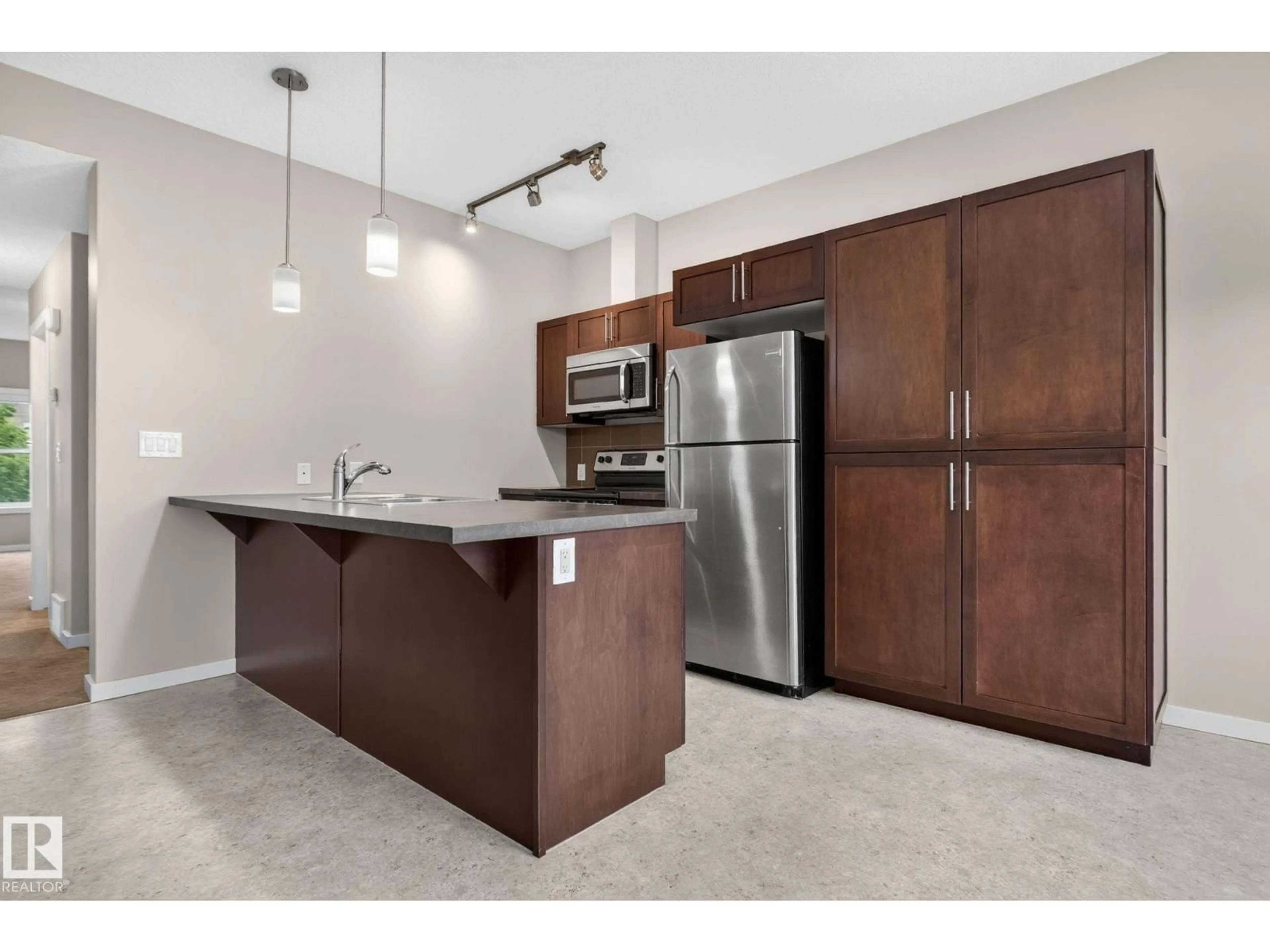 Open concept kitchen, unknown for #57 - 3710 ALLAN DR, Edmonton Alberta T6W2C4