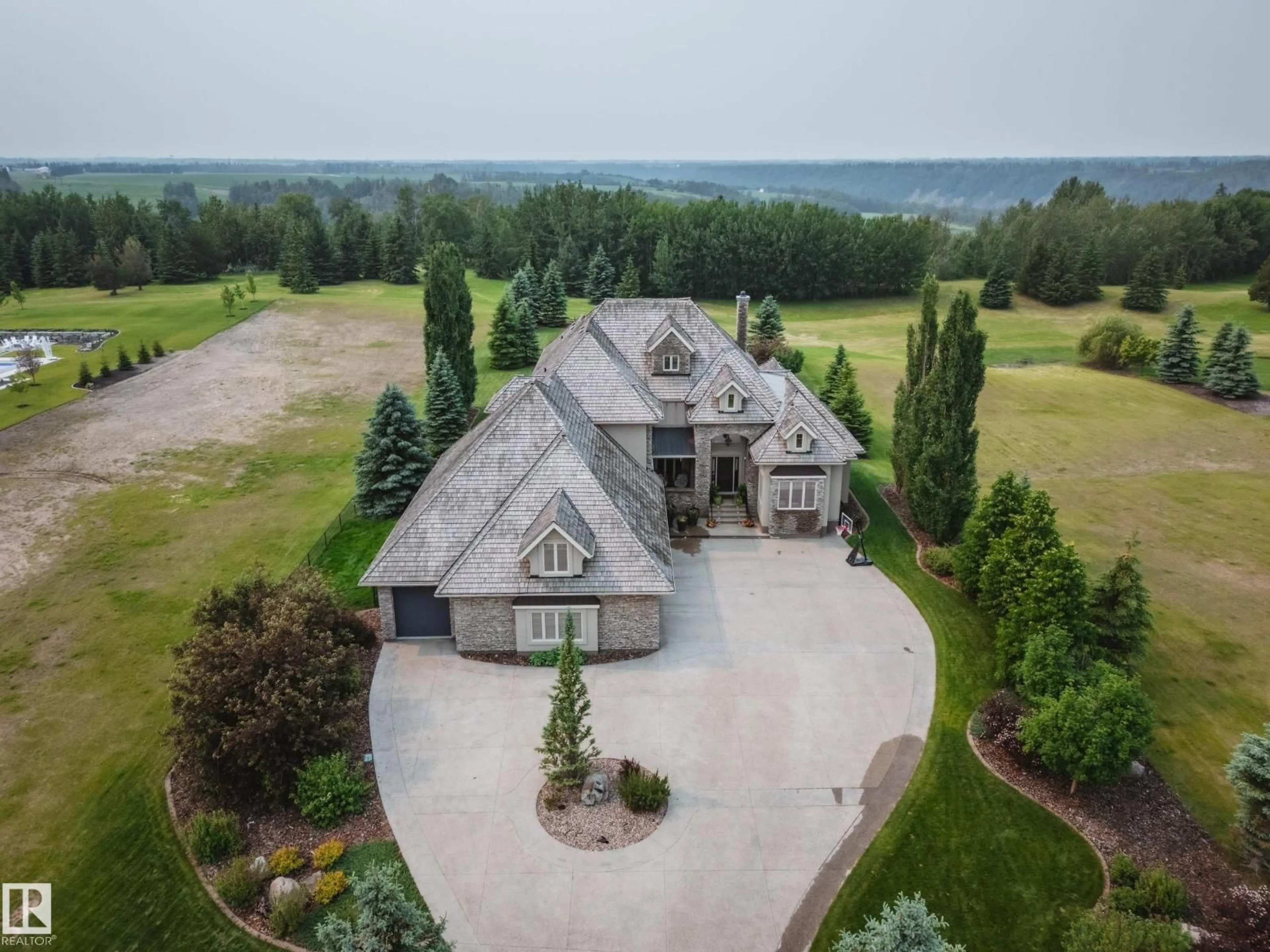 A pic from outside/outdoor area/front of a property/back of a property/a pic from drone, unknown for 25515 TWP ROAD 511 A, Rural Parkland County Alberta T7Y1A8