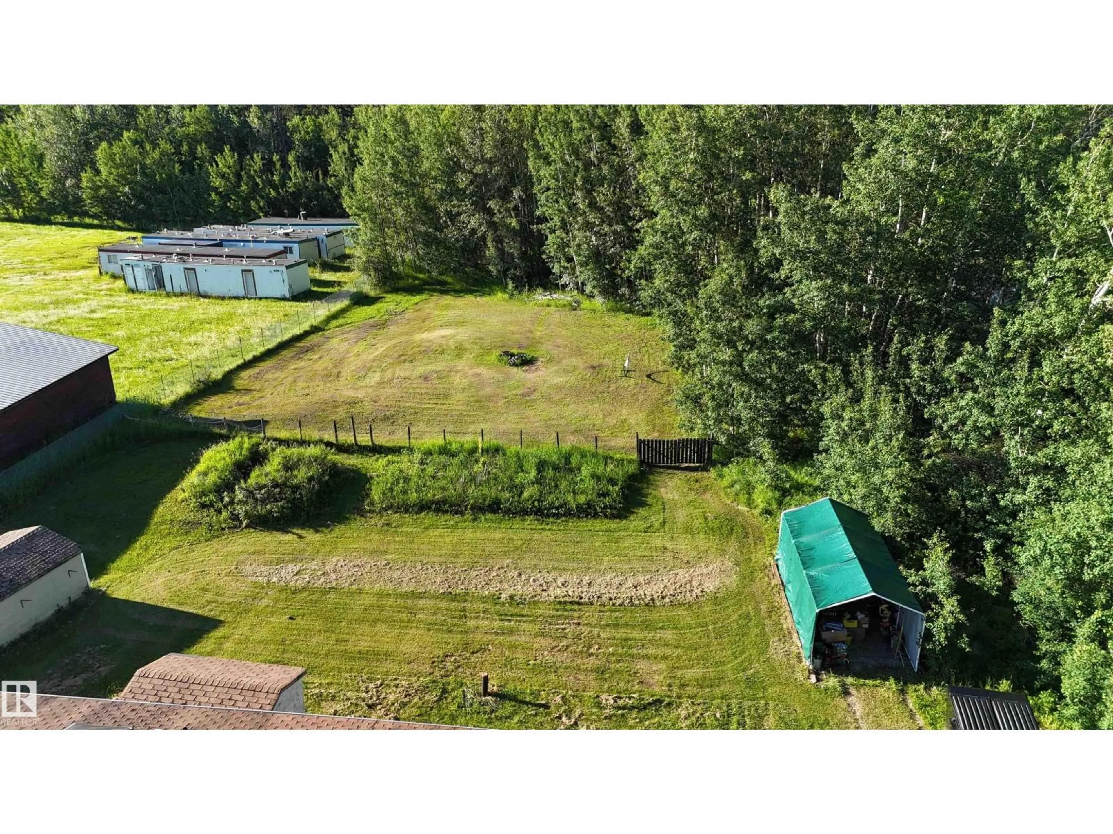 A pic from outside/outdoor area/front of a property/back of a property/a pic from drone, unknown for 6118 HWY 16, Rural Parkland County Alberta T0E0W0