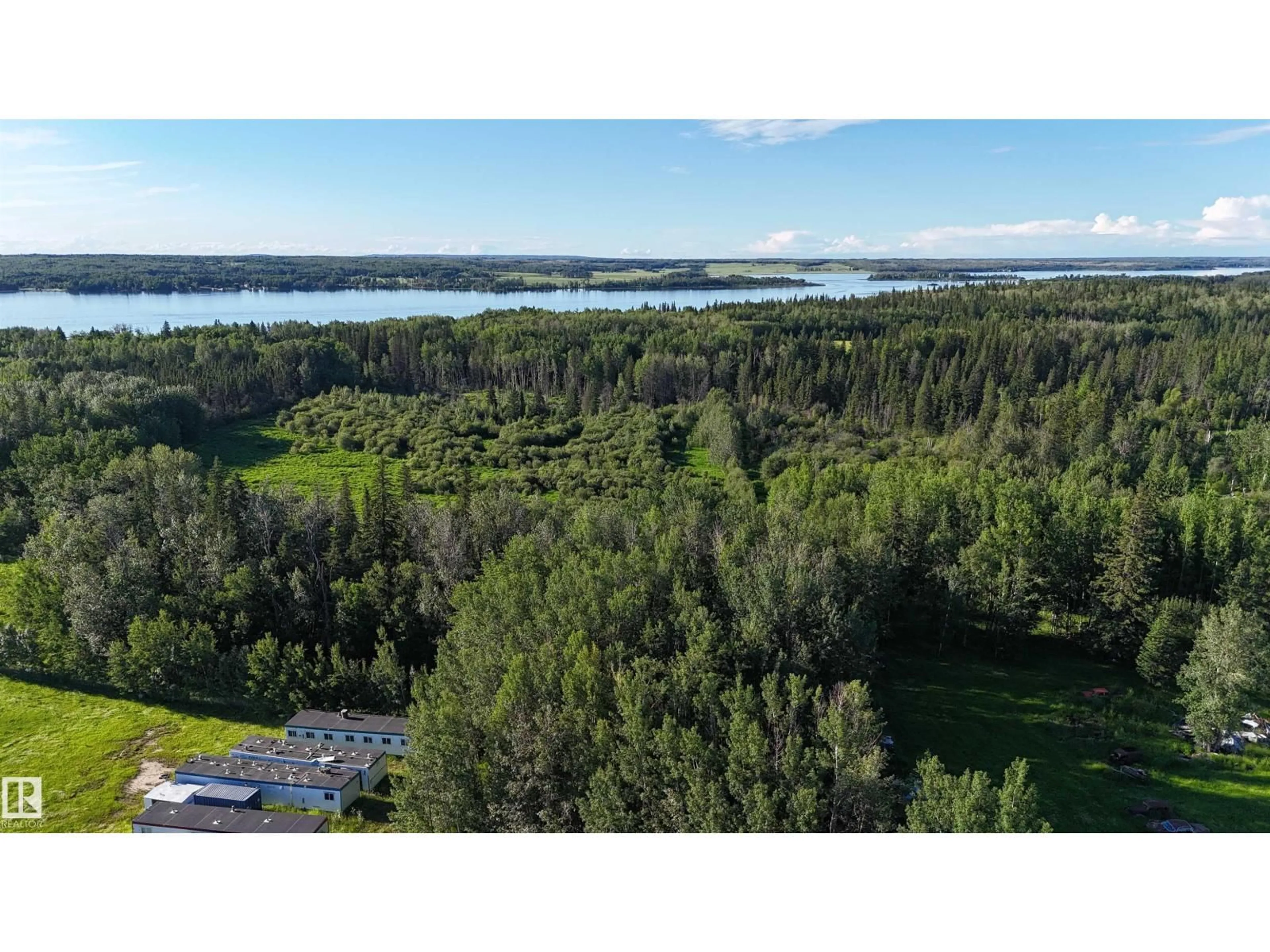A pic from outside/outdoor area/front of a property/back of a property/a pic from drone, water/lake/river/ocean view for 6118 HWY 16, Rural Parkland County Alberta T0E0W0