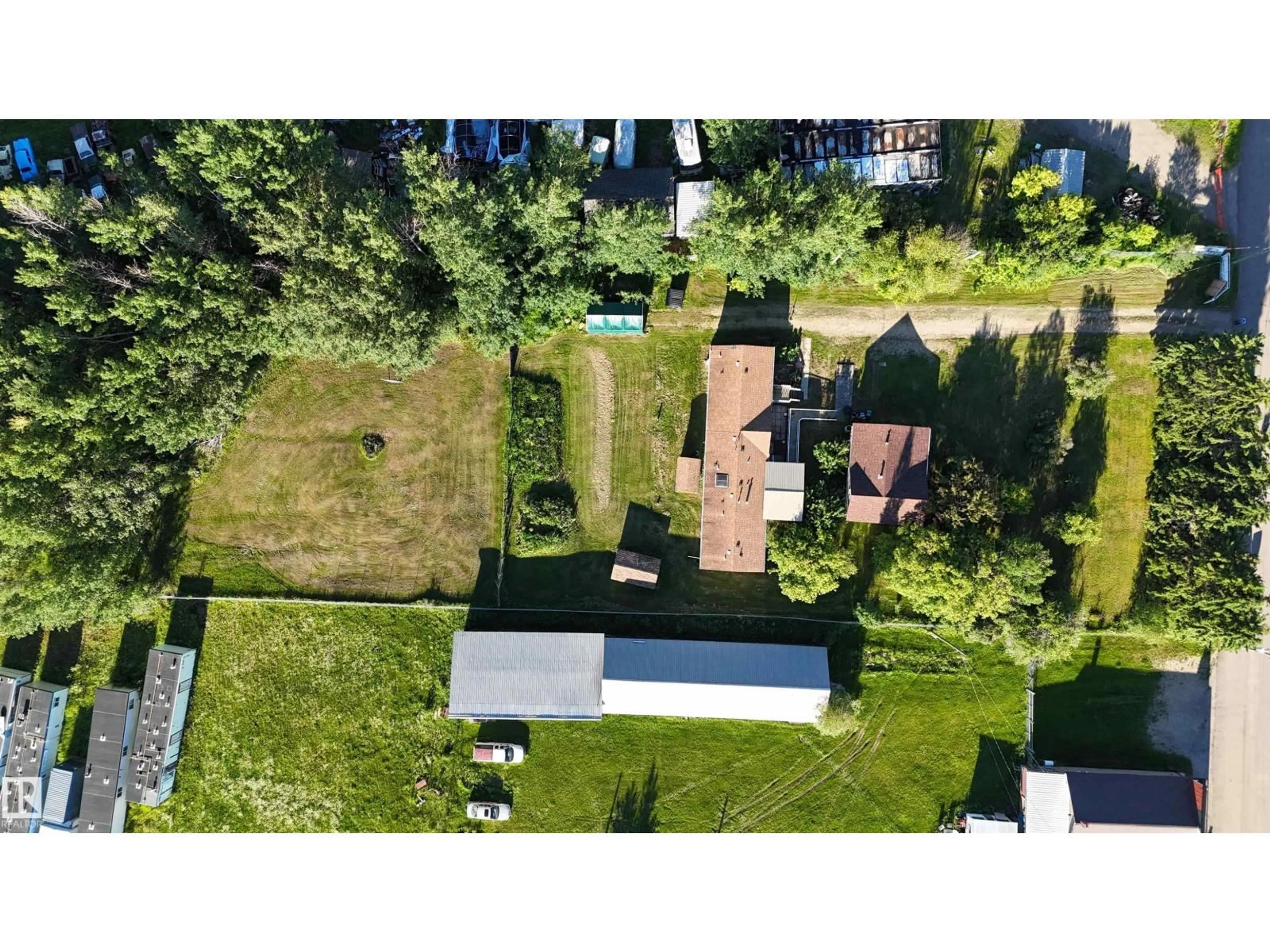 A pic from outside/outdoor area/front of a property/back of a property/a pic from drone, street for 6118 HWY 16, Rural Parkland County Alberta T0E0W0