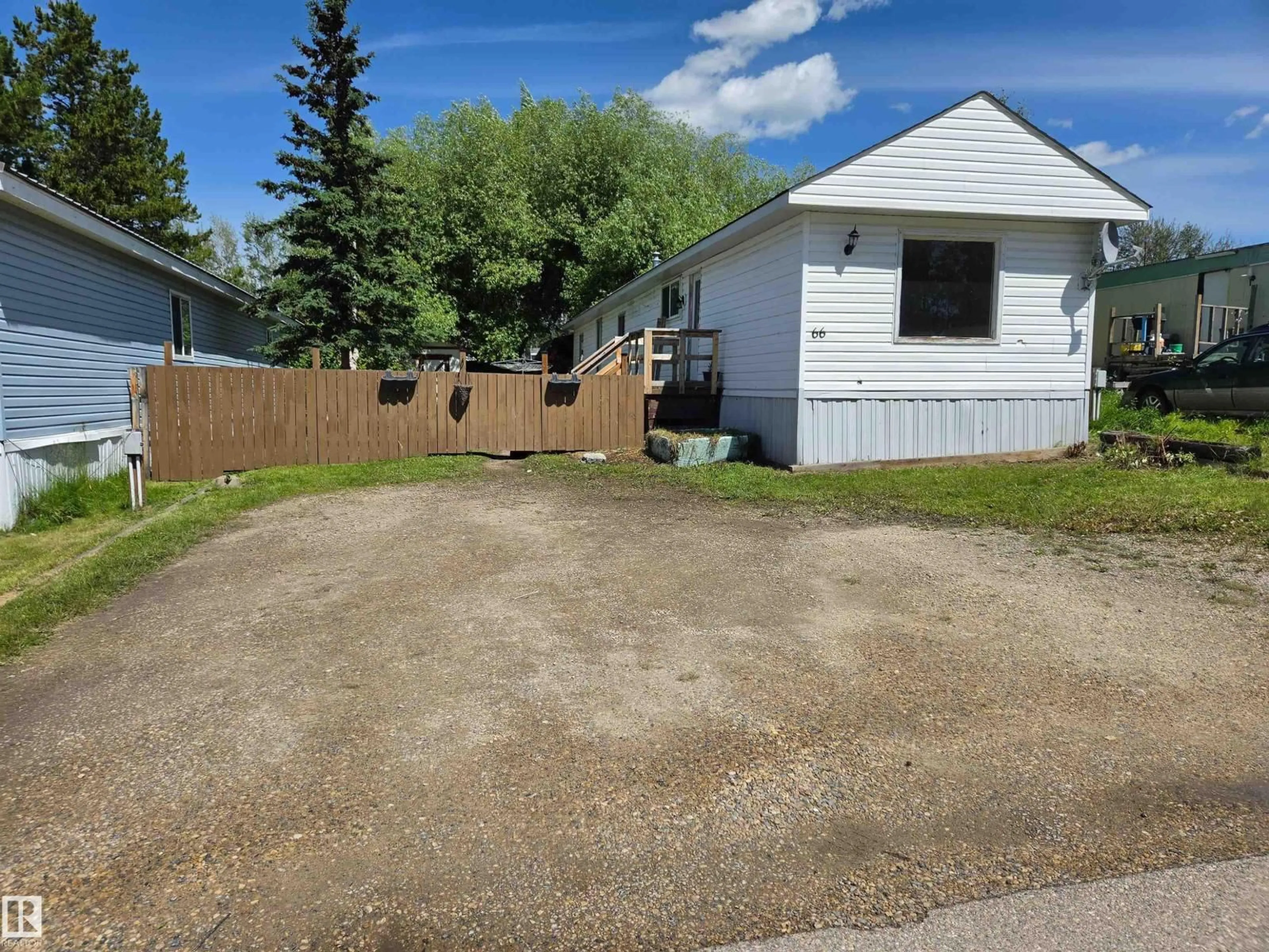 A pic from outside/outdoor area/front of a property/back of a property/a pic from drone, street for #66 - 2251 50 STREET, Drayton Valley Alberta T7A1M9