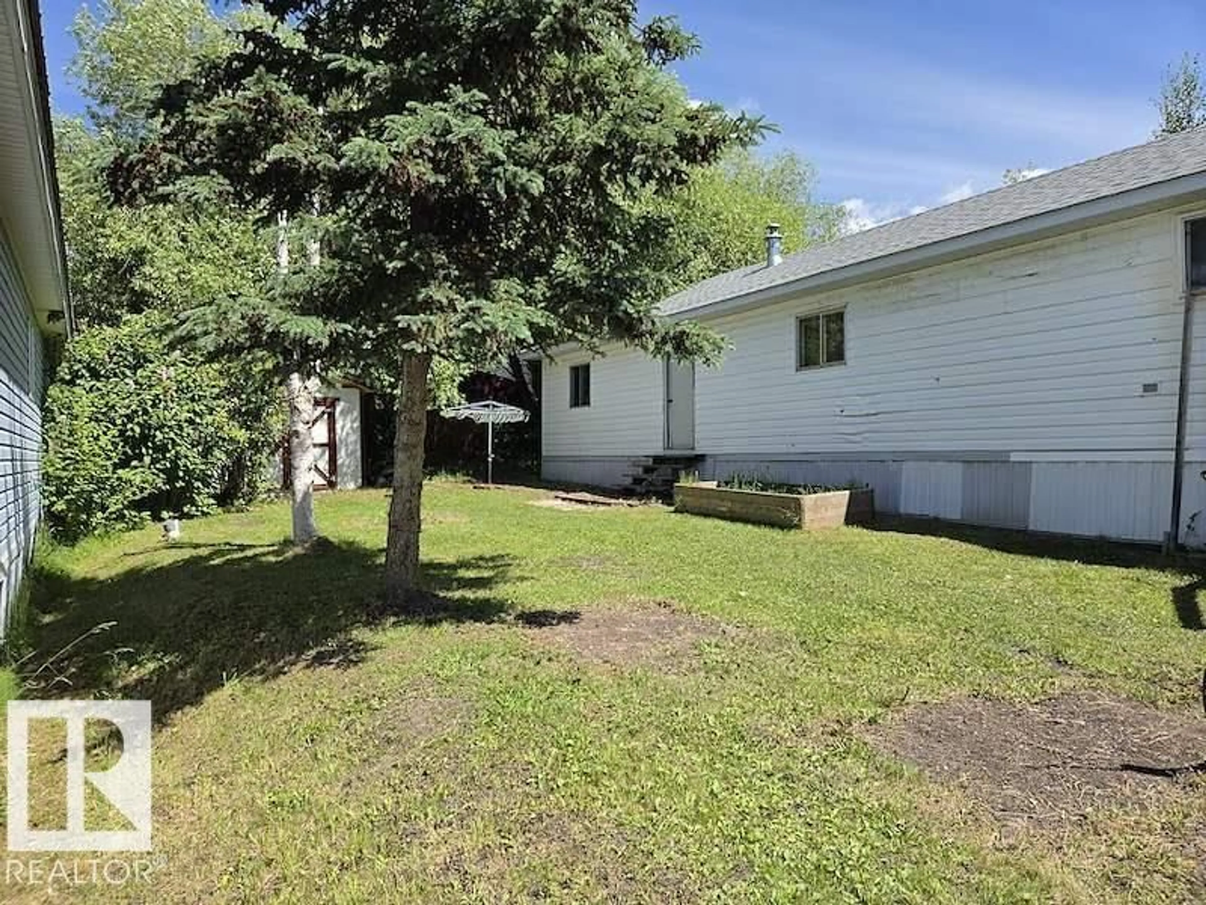 A pic from outside/outdoor area/front of a property/back of a property/a pic from drone, street for #66 - 2251 50 STREET, Drayton Valley Alberta T7A1M9