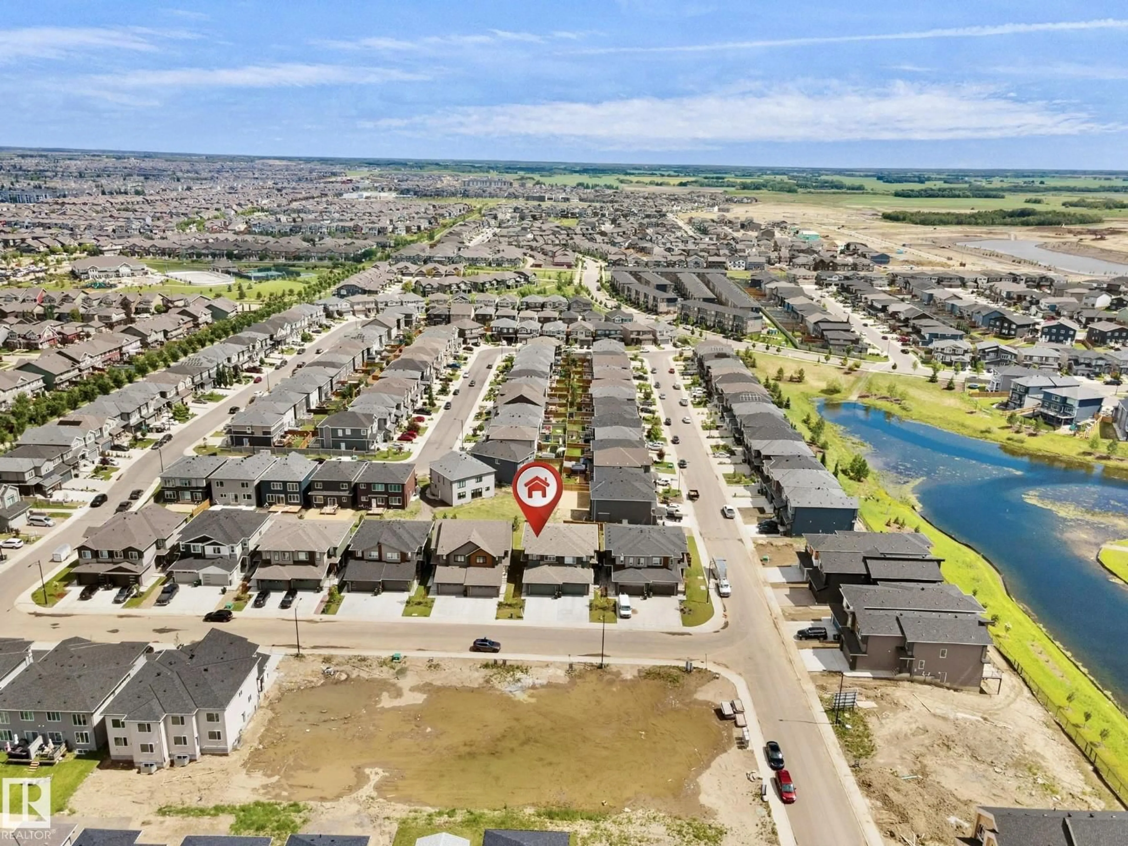 A pic from outside/outdoor area/front of a property/back of a property/a pic from drone, water/lake/river/ocean view for 8523 MAYDAY RUN, Edmonton Alberta T6X3E9