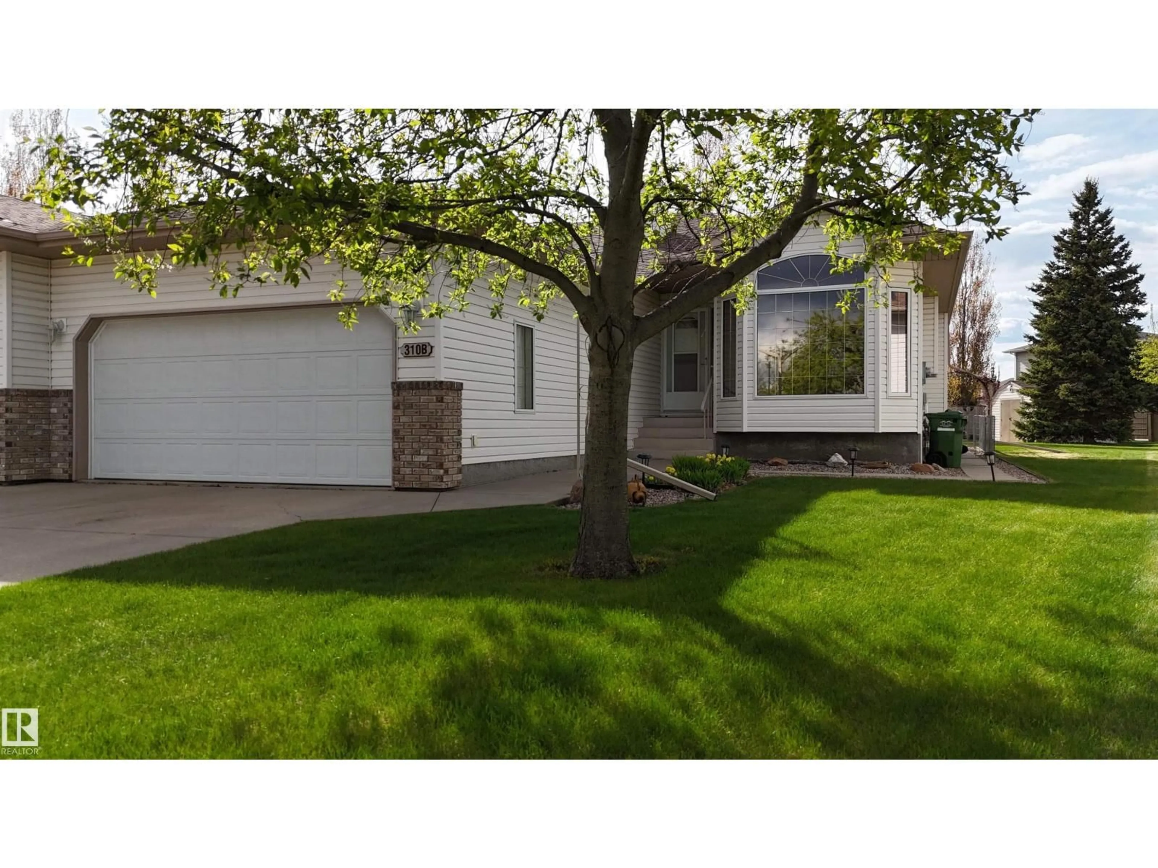 Home with vinyl exterior material, street for 310B EDGEWOOD CL, Camrose Alberta T4V4P9
