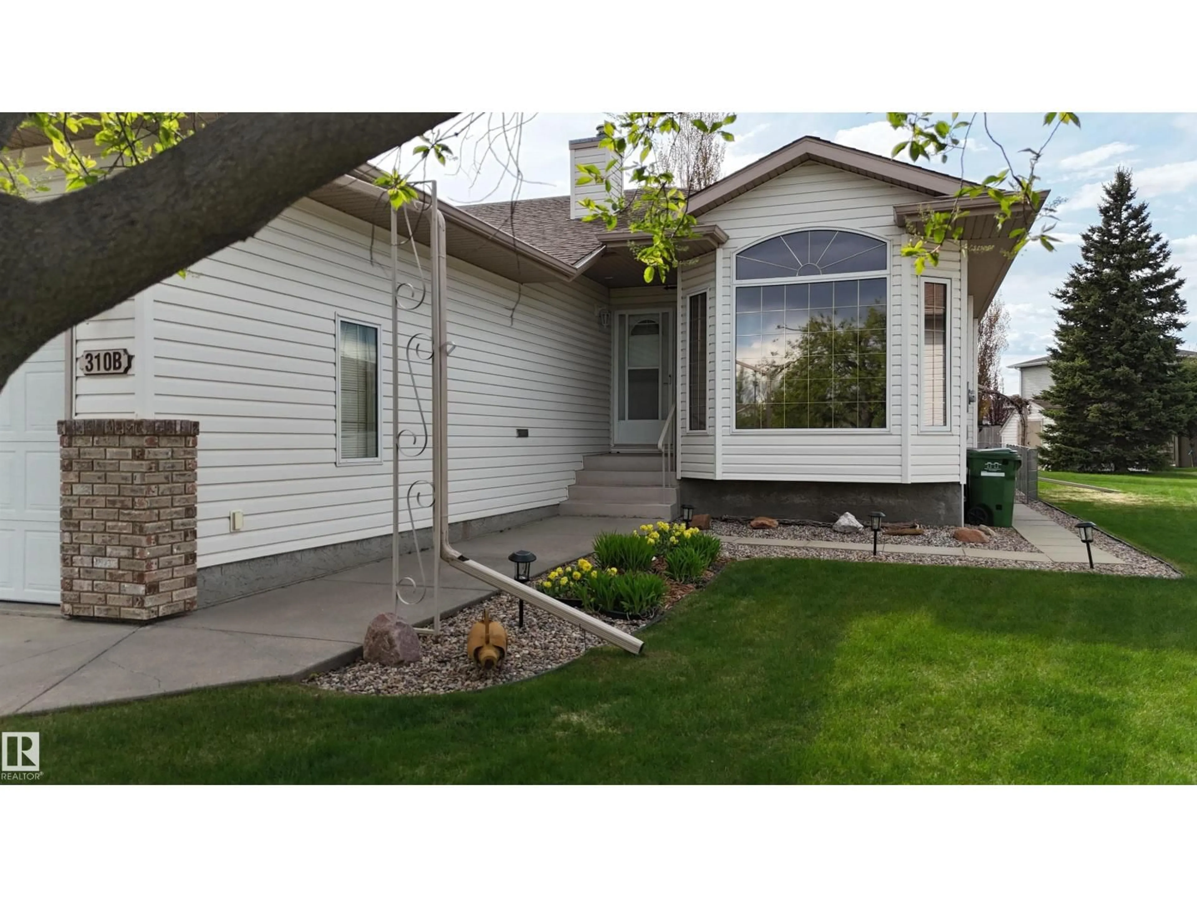 Home with vinyl exterior material, street for 310B EDGEWOOD CL, Camrose Alberta T4V4P9