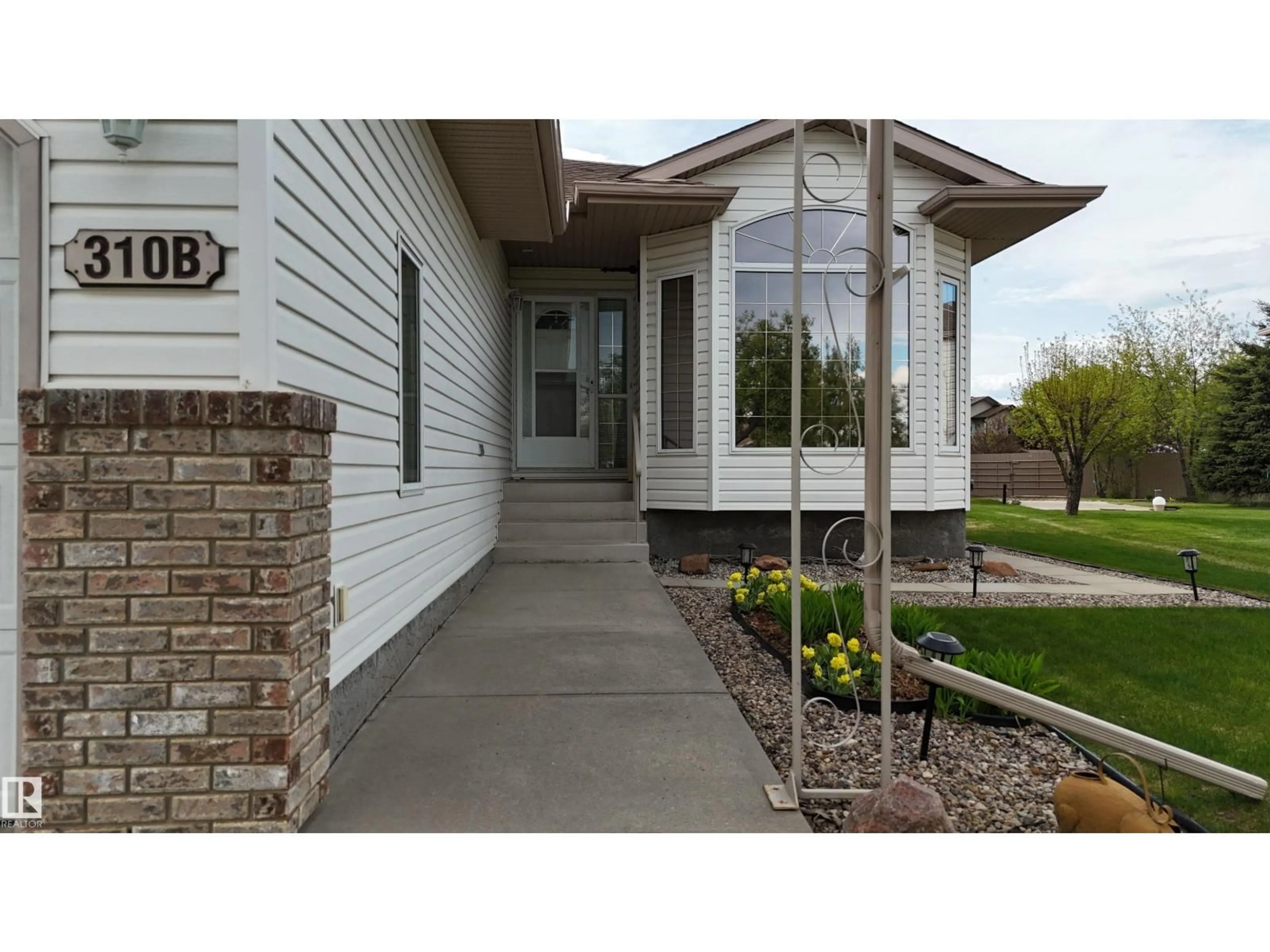 Home with vinyl exterior material, street for 310B EDGEWOOD CL, Camrose Alberta T4V4P9