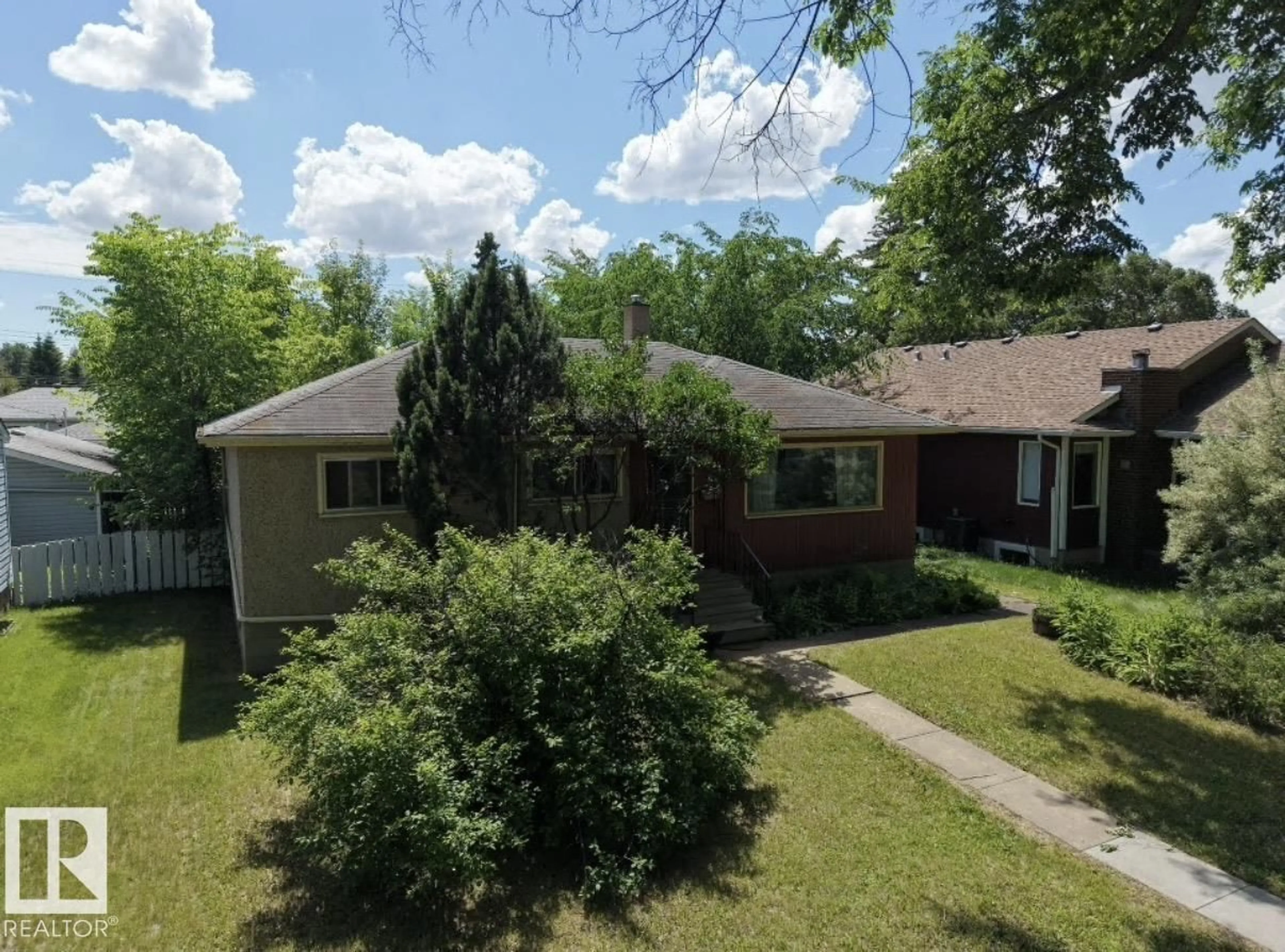 A pic from outside/outdoor area/front of a property/back of a property/a pic from drone, street for 8719 67 AV, Edmonton Alberta T6E0M9