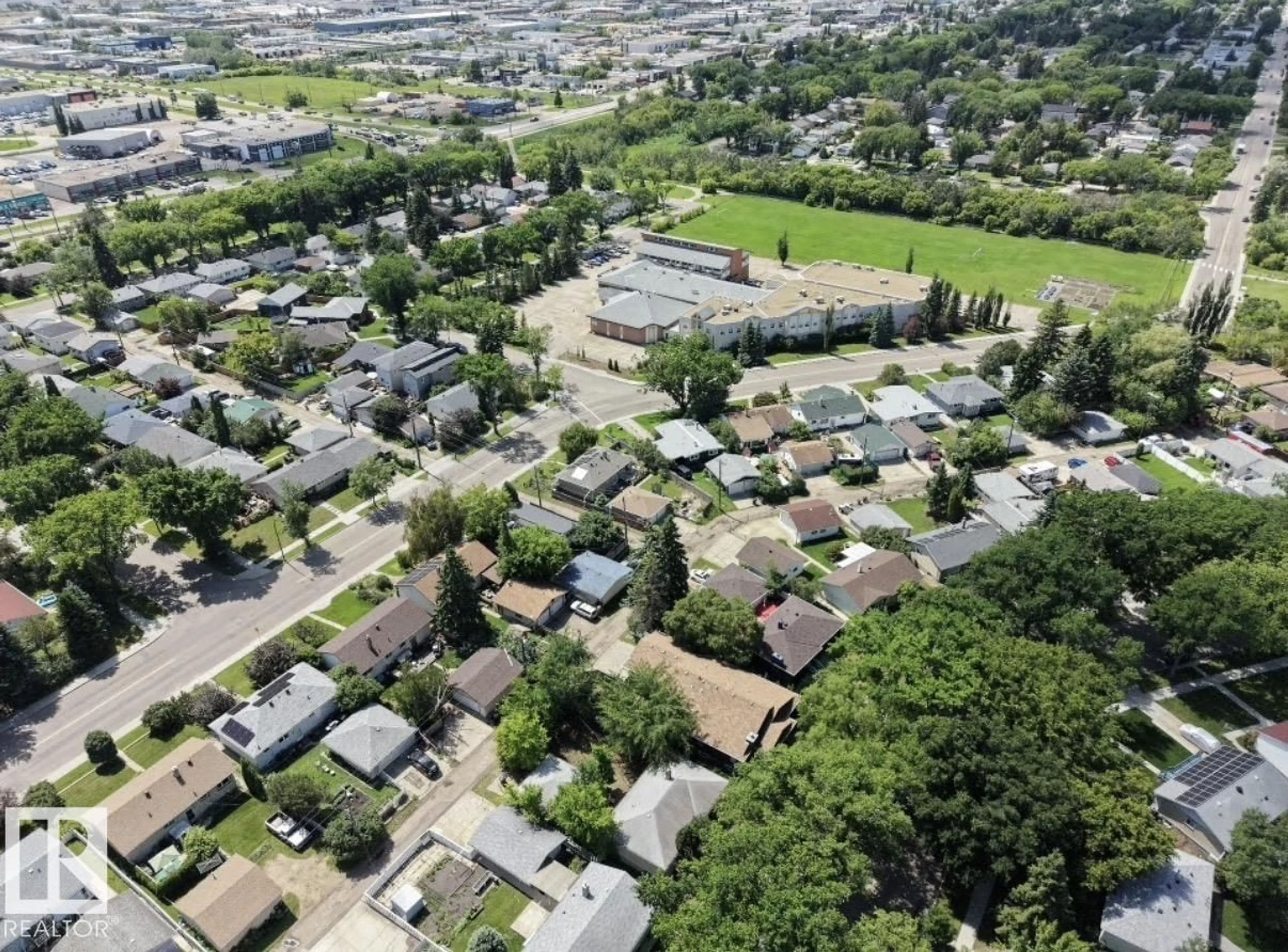 A pic from outside/outdoor area/front of a property/back of a property/a pic from drone, street for 8719 67 AV, Edmonton Alberta T6E0M9
