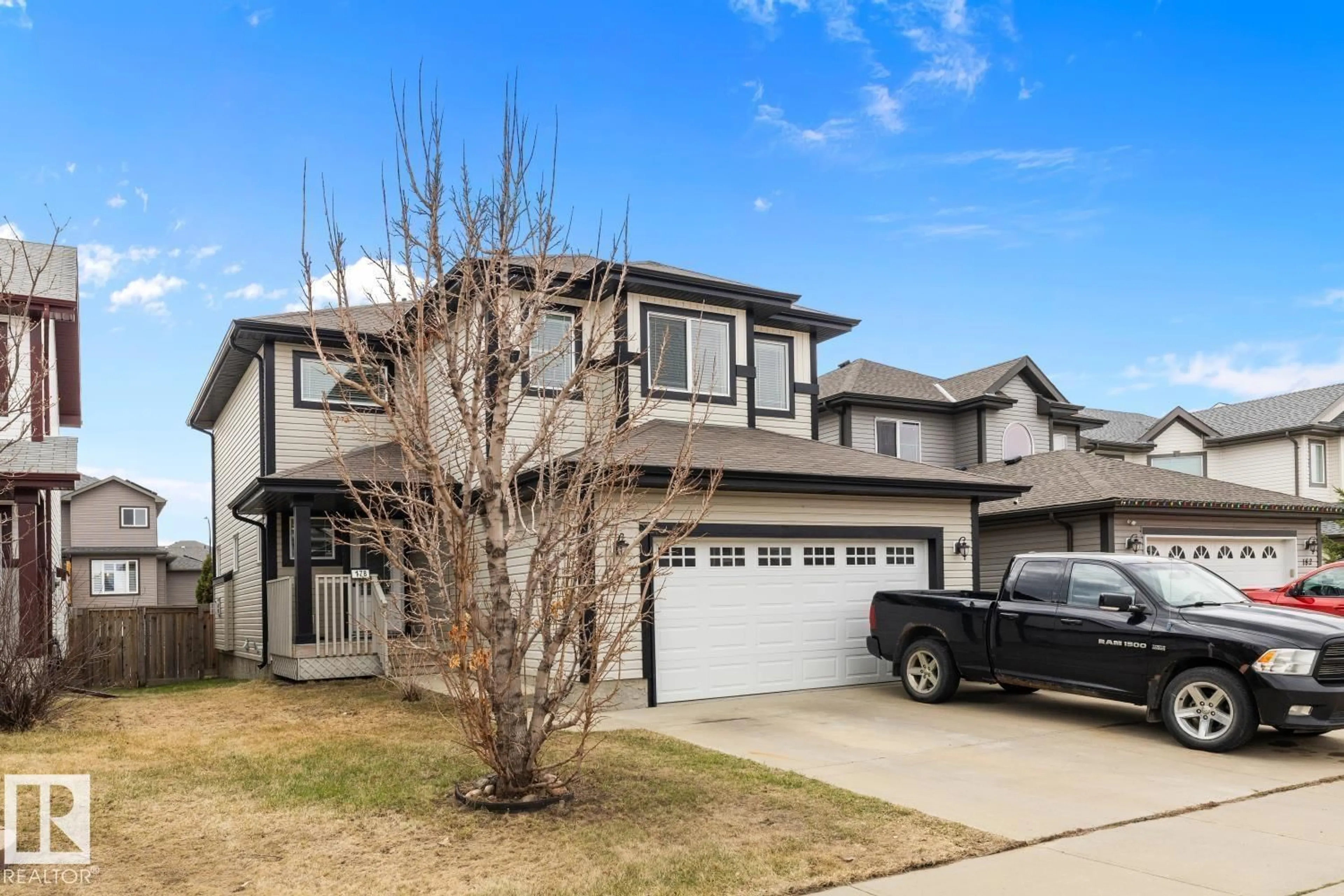 Home with vinyl exterior material, street for 178 WOODBEND WY, Fort Saskatchewan Alberta T8L4S4