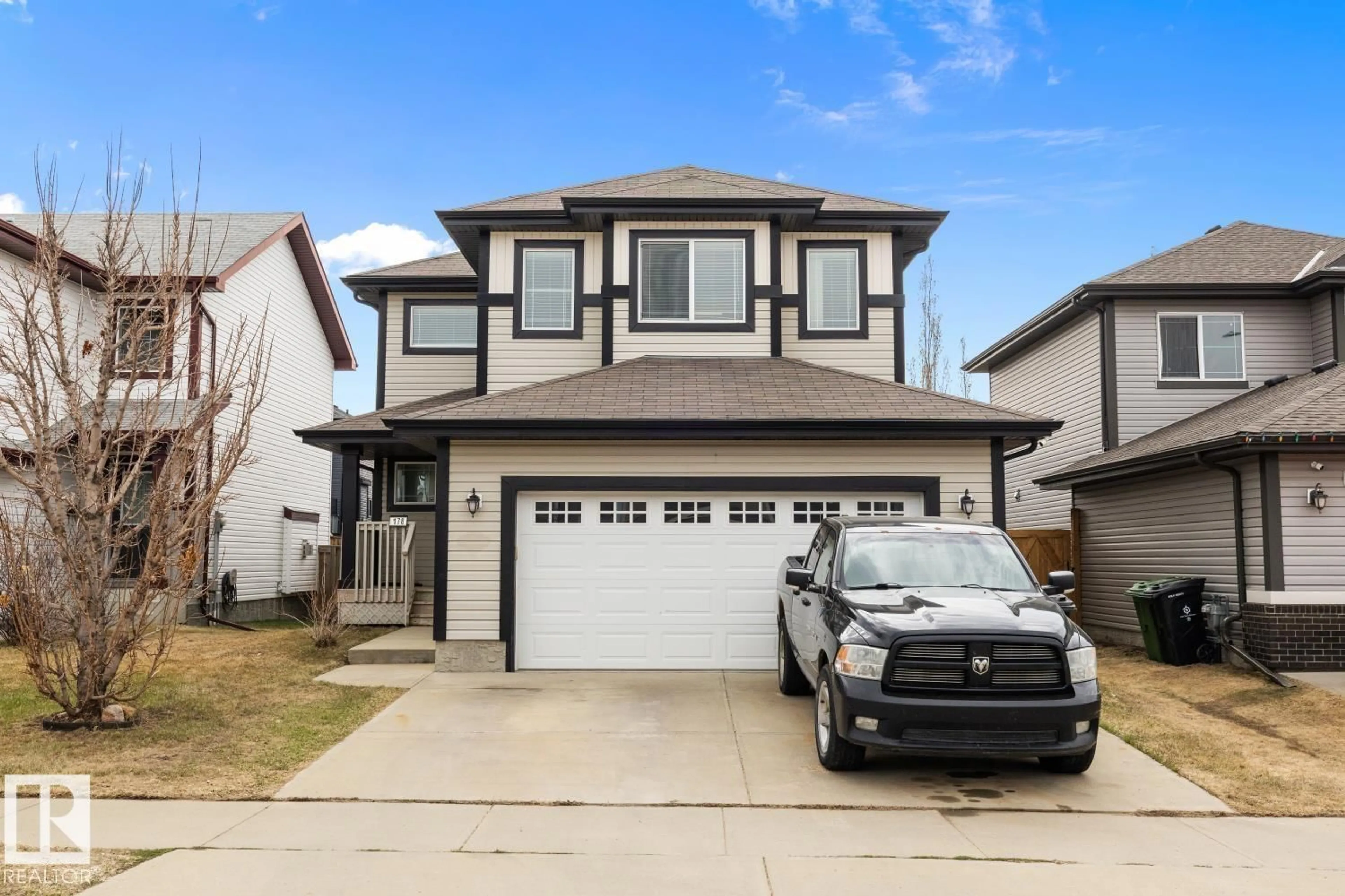 Home with vinyl exterior material, street for 178 WOODBEND WY, Fort Saskatchewan Alberta T8L4S4