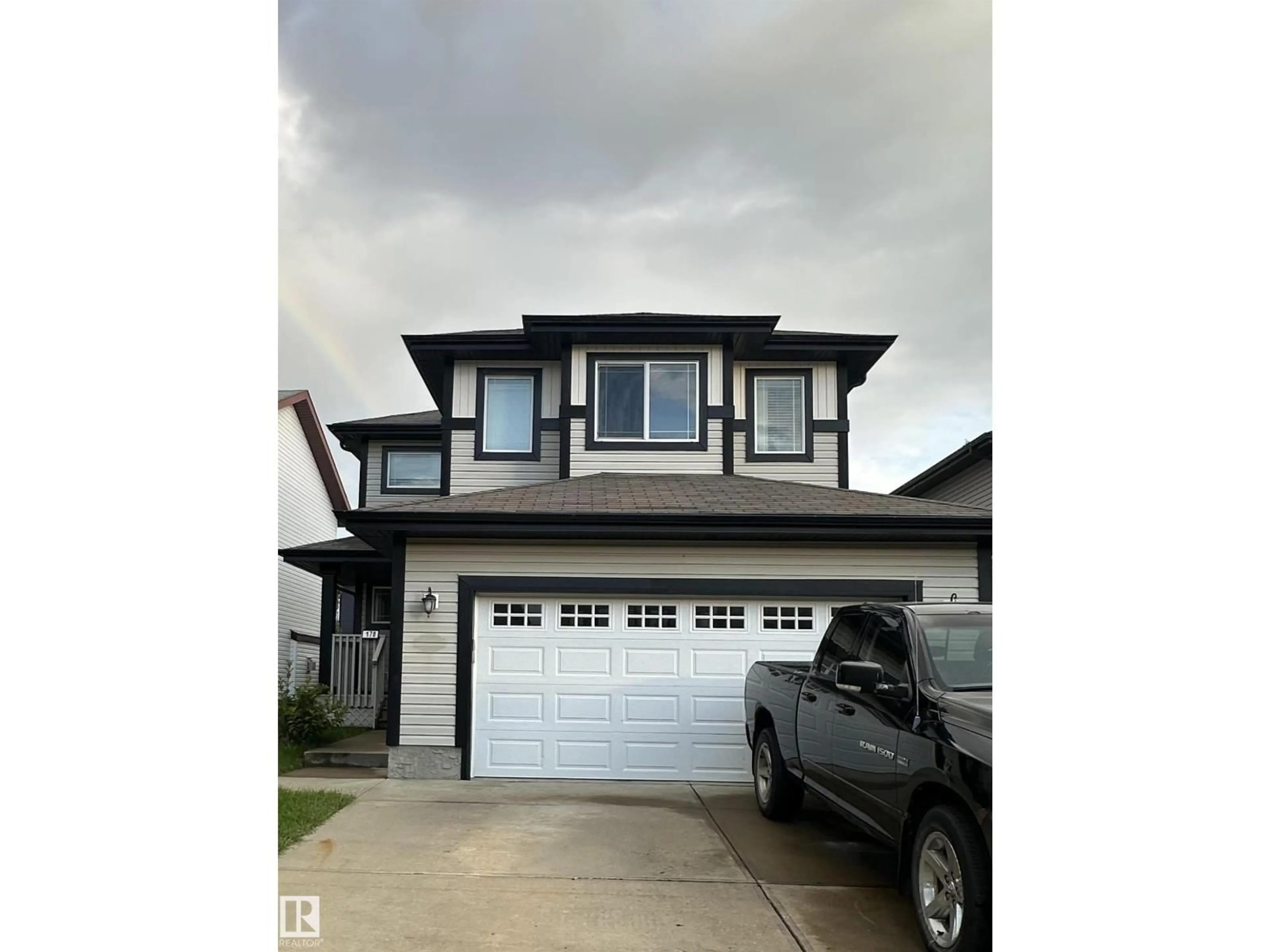 Home with vinyl exterior material, street for 178 WOODBEND WY, Fort Saskatchewan Alberta T8L4S4