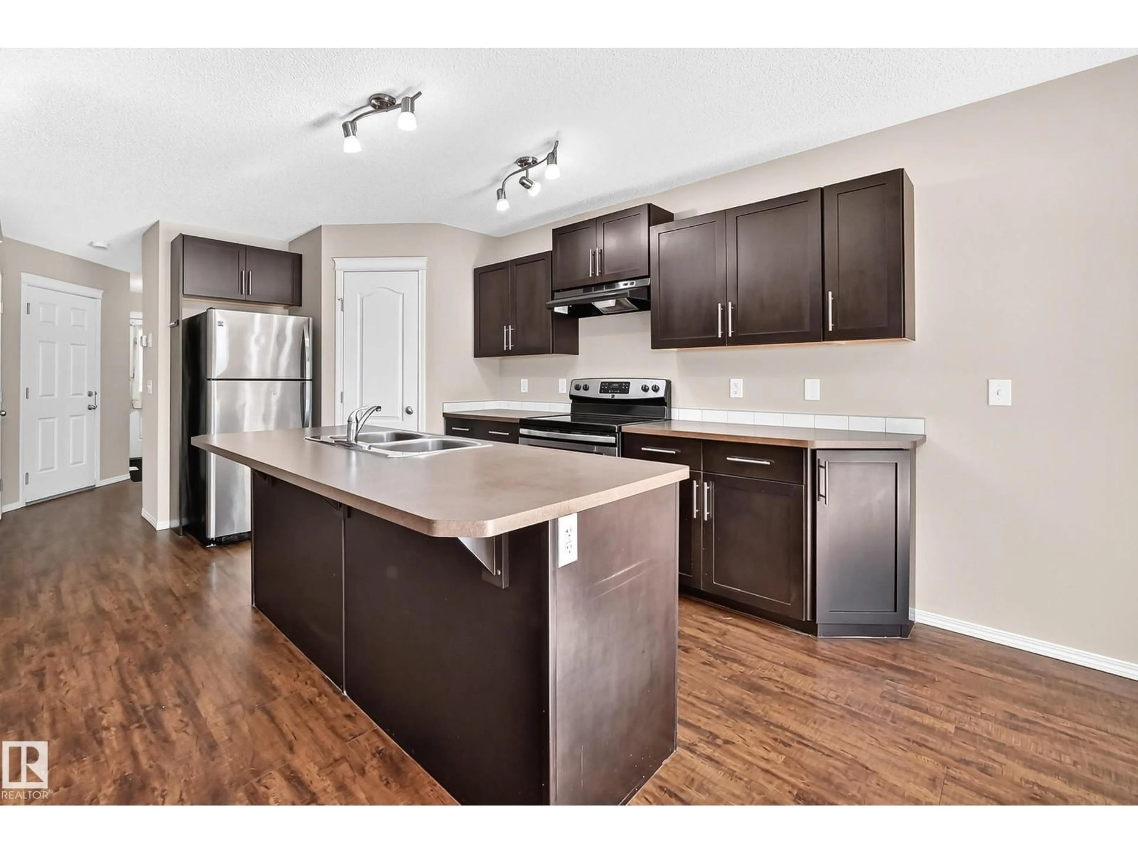 Open concept kitchen, wood/laminate floor for 1806 RUTHERFORD RD, Edmonton Alberta T6W2K6