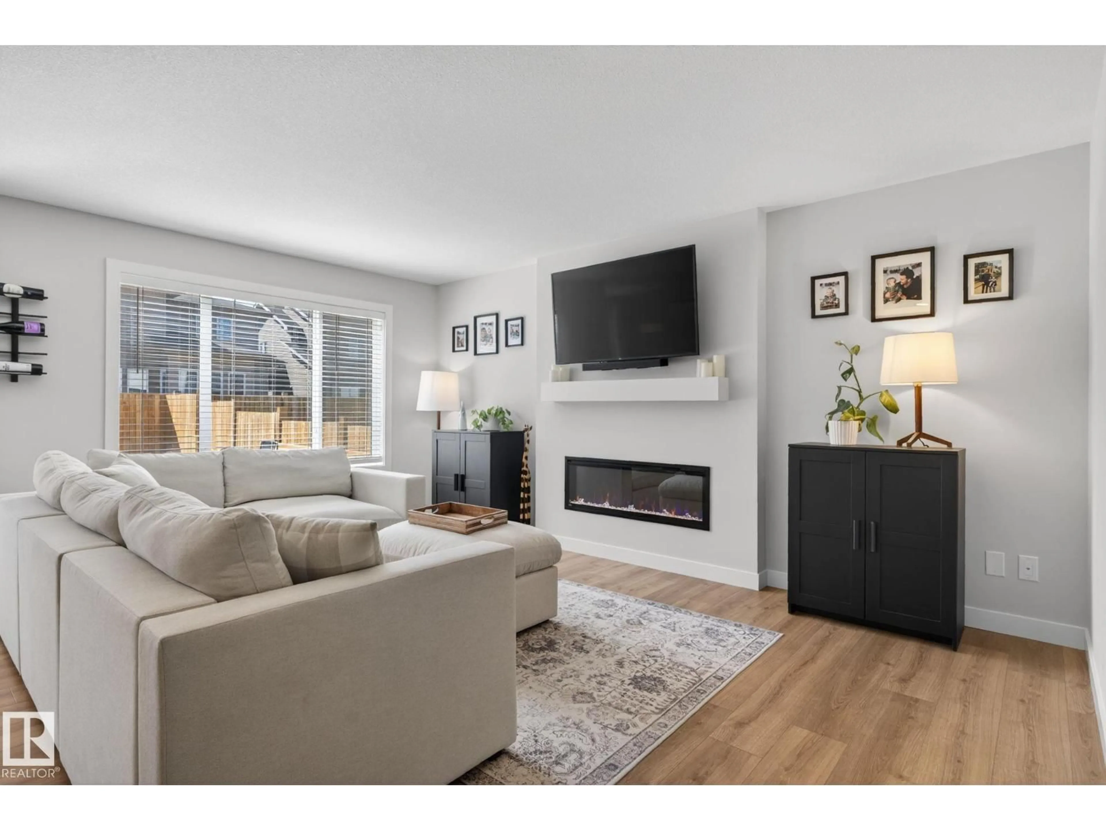 Living room with furniture, wood/laminate floor for 77 PENN PL, Spruce Grove Alberta T7X2W7