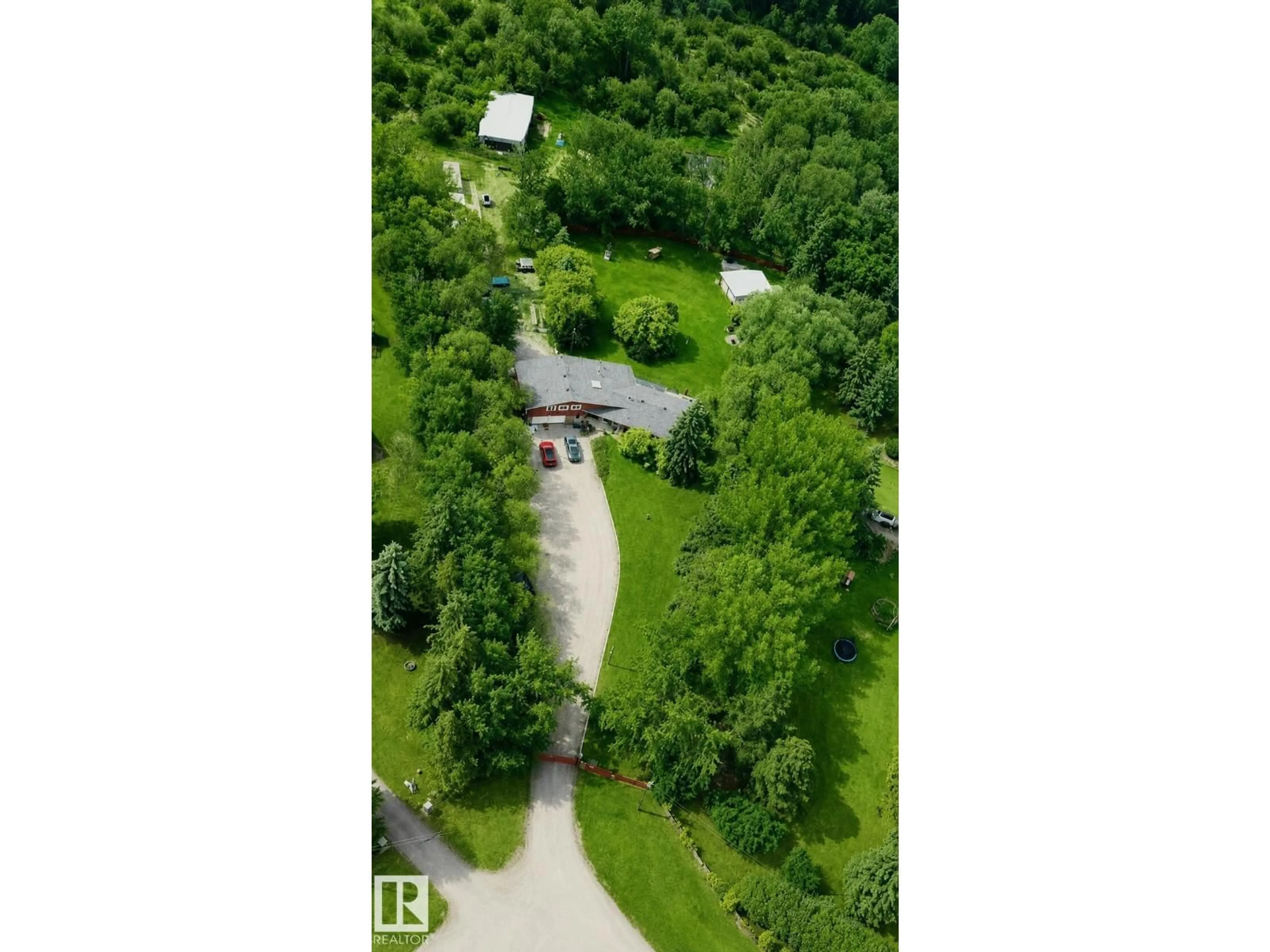 A pic from outside/outdoor area/front of a property/back of a property/a pic from drone, forest/trees view for 51526 RGE ROAD 273, Rural Parkland County Alberta T7Y1H7