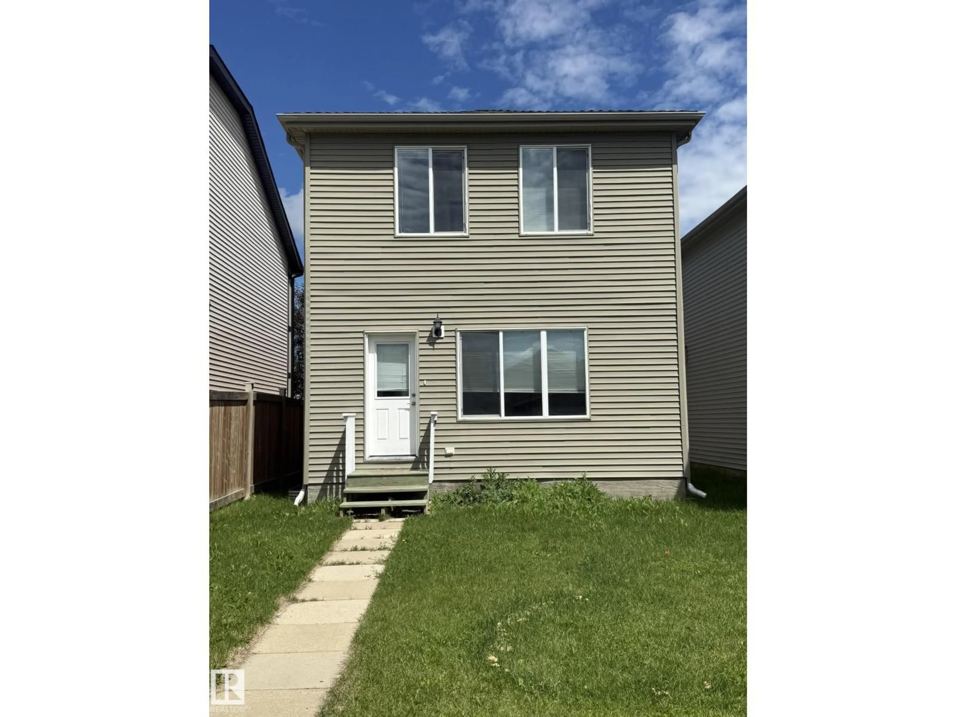 Home with vinyl exterior material, street for NW - 8305 ELLIS CR, Edmonton Alberta T6M2N5