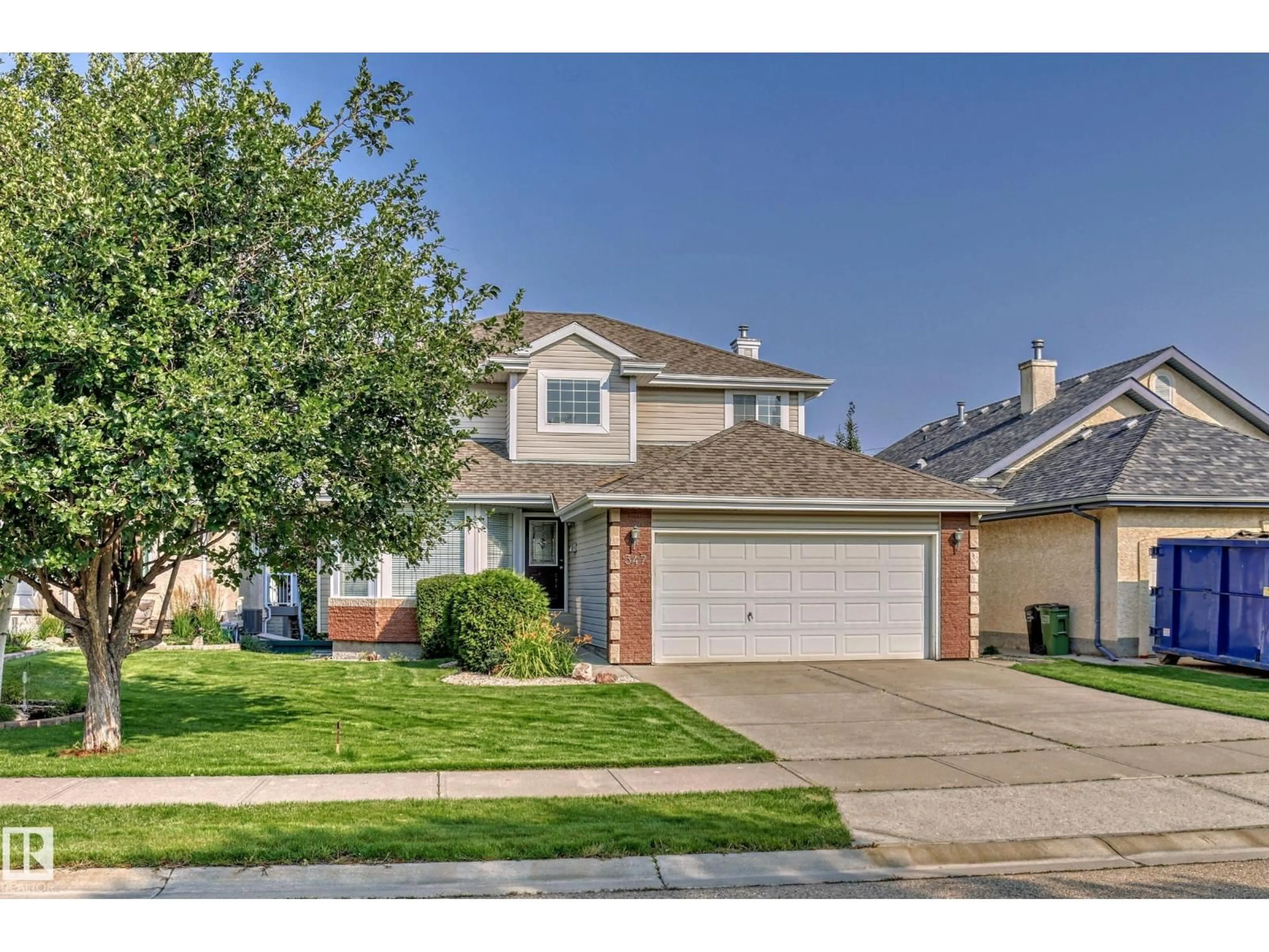 Home with vinyl exterior material, street for NW - 347 HUNTERS RU, Edmonton Alberta T6R2N9