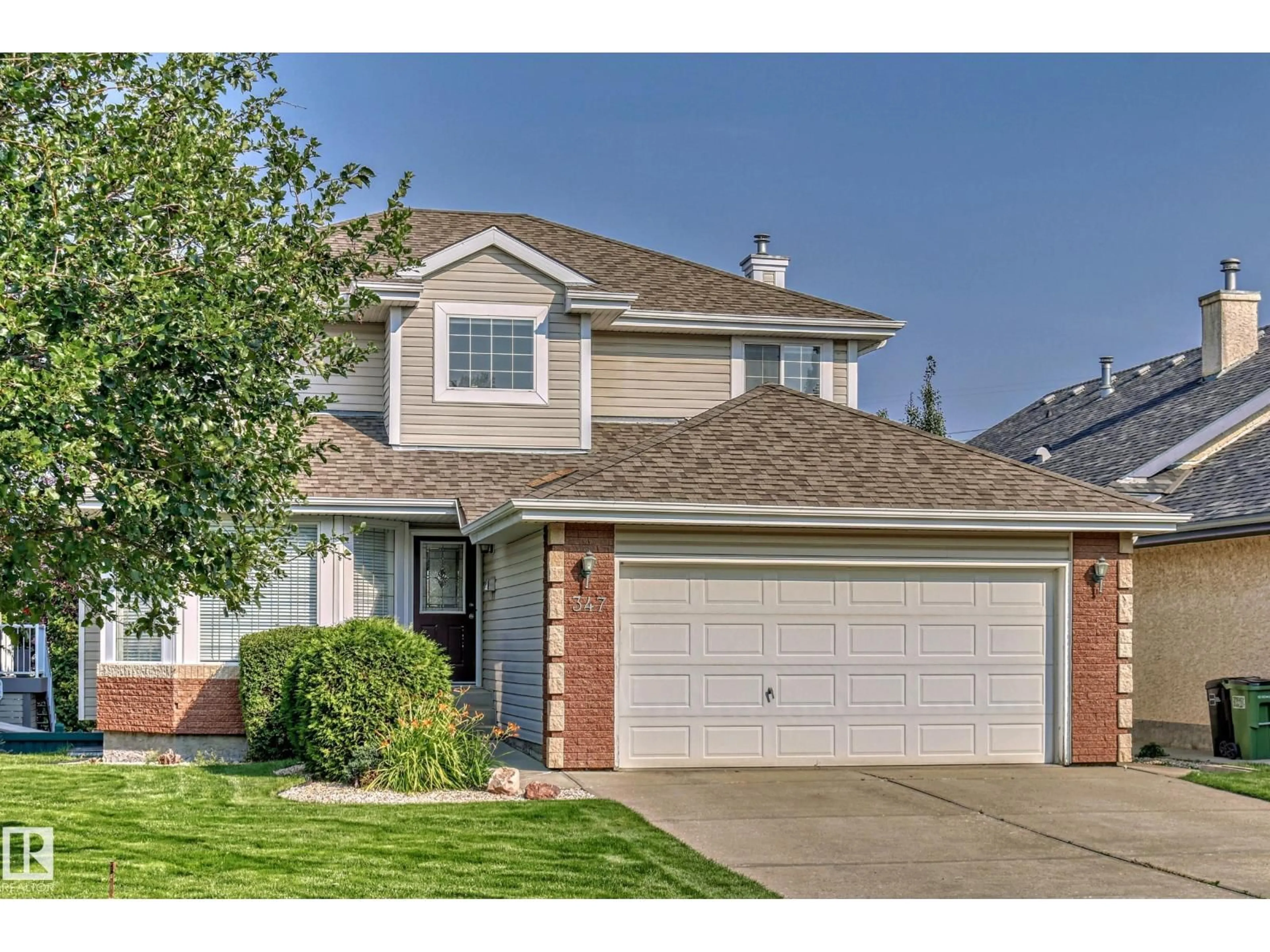 Home with vinyl exterior material, street for NW - 347 HUNTERS RU, Edmonton Alberta T6R2N9