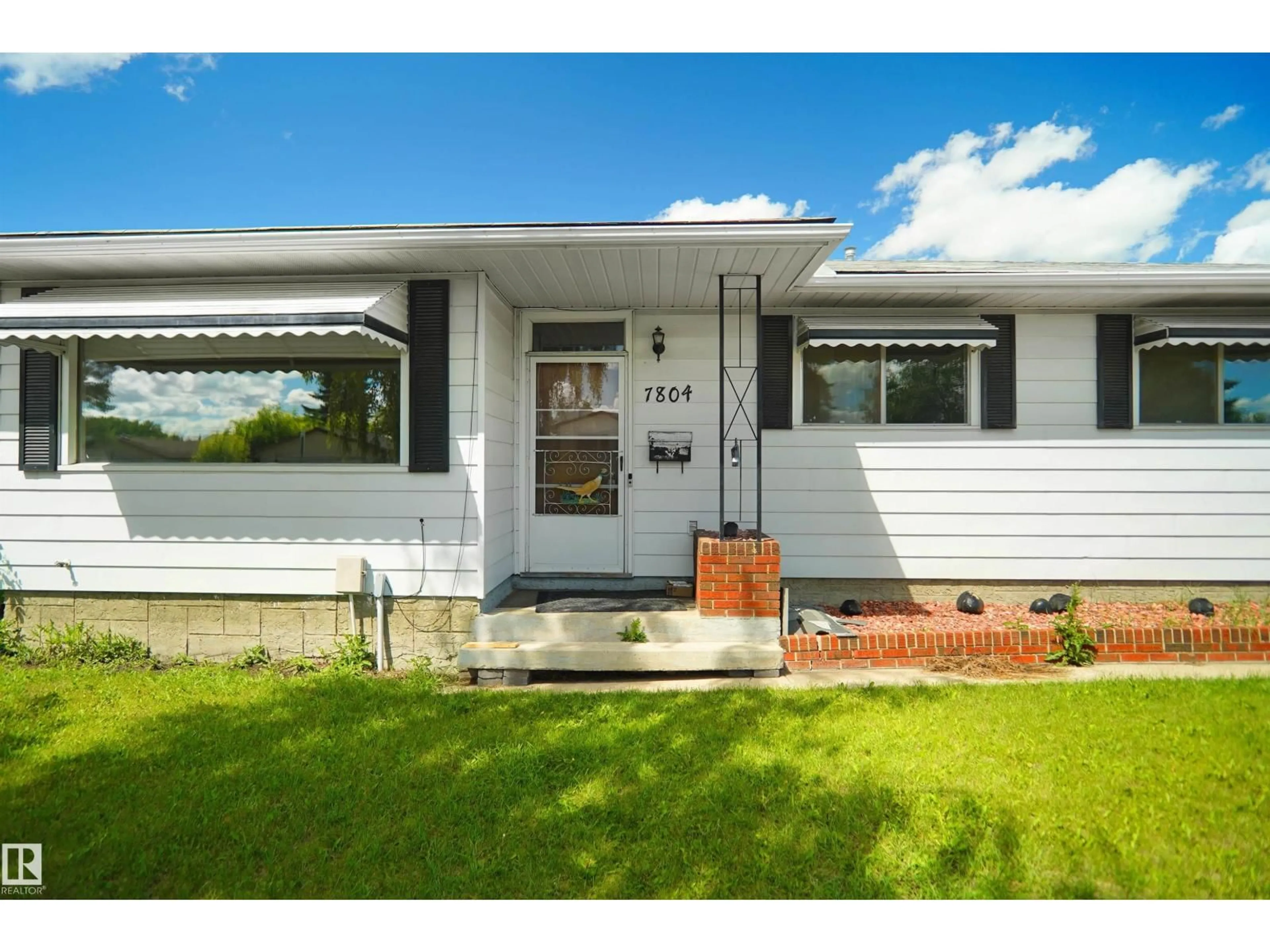 Home with vinyl exterior material, street for 7804 143 AV, Edmonton Alberta T5C2R1